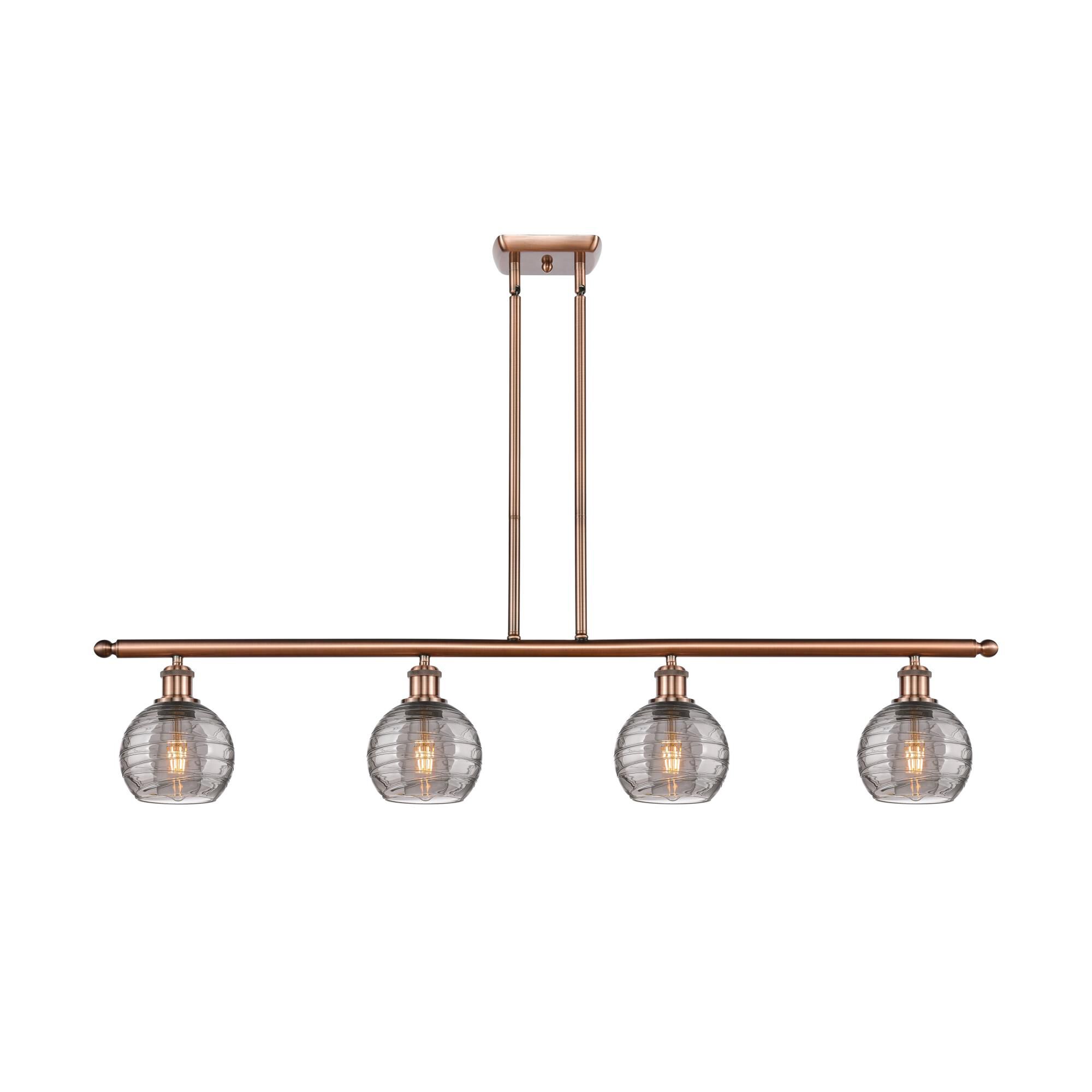 Shown in Antique Copper finish and Light Smoke Deco Swirl glass