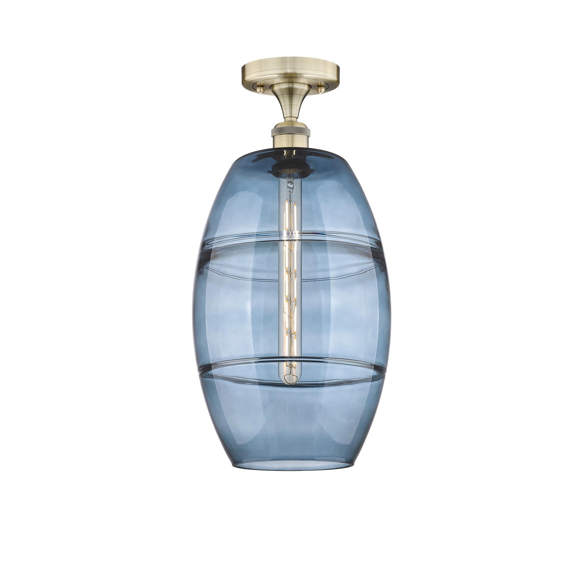 Shown in Antique Brass finish and Princess Blue glass