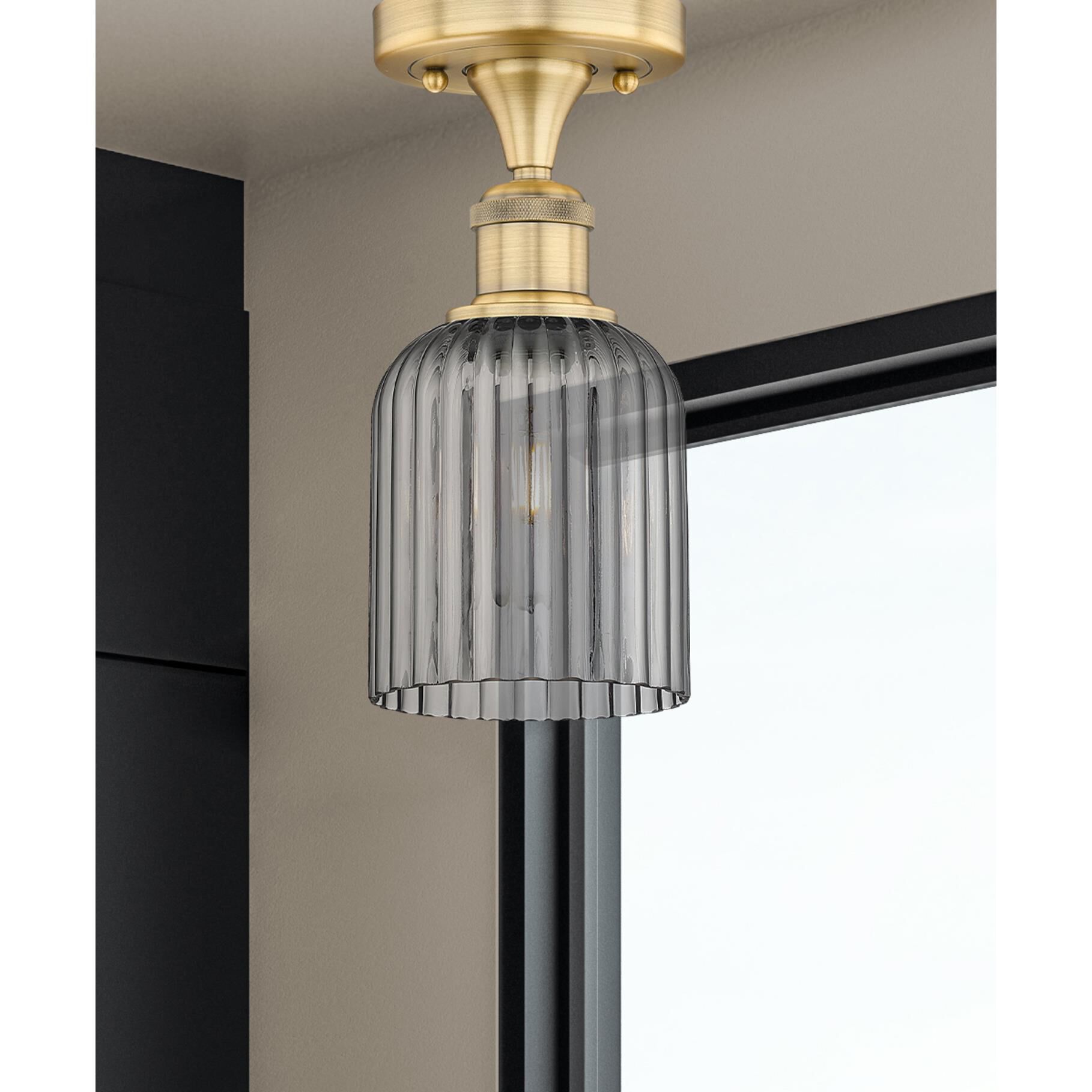 Shown in Brushed Brass finish and Light Smoke glass