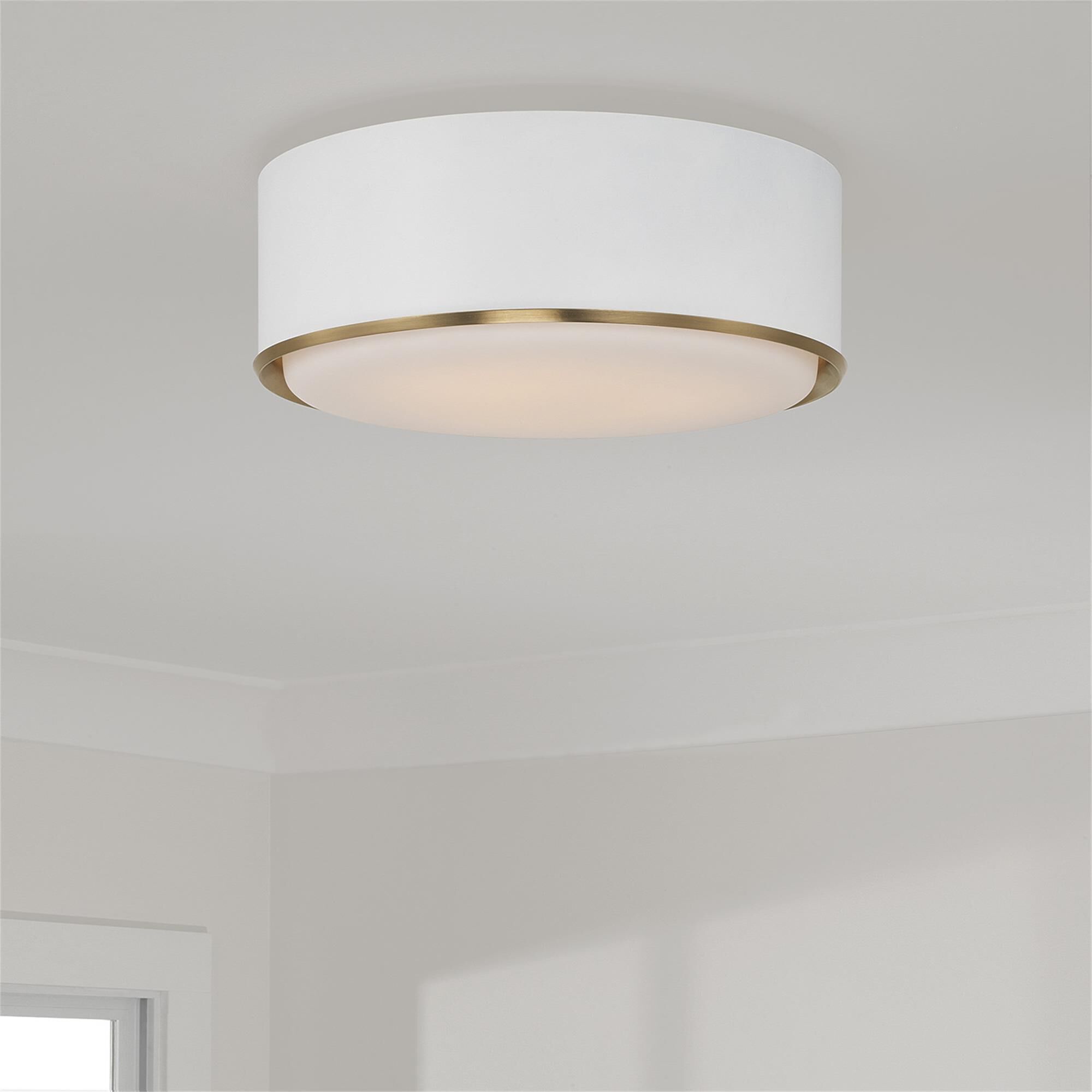 Shown in Matte Brass And White finish and Soft White glass