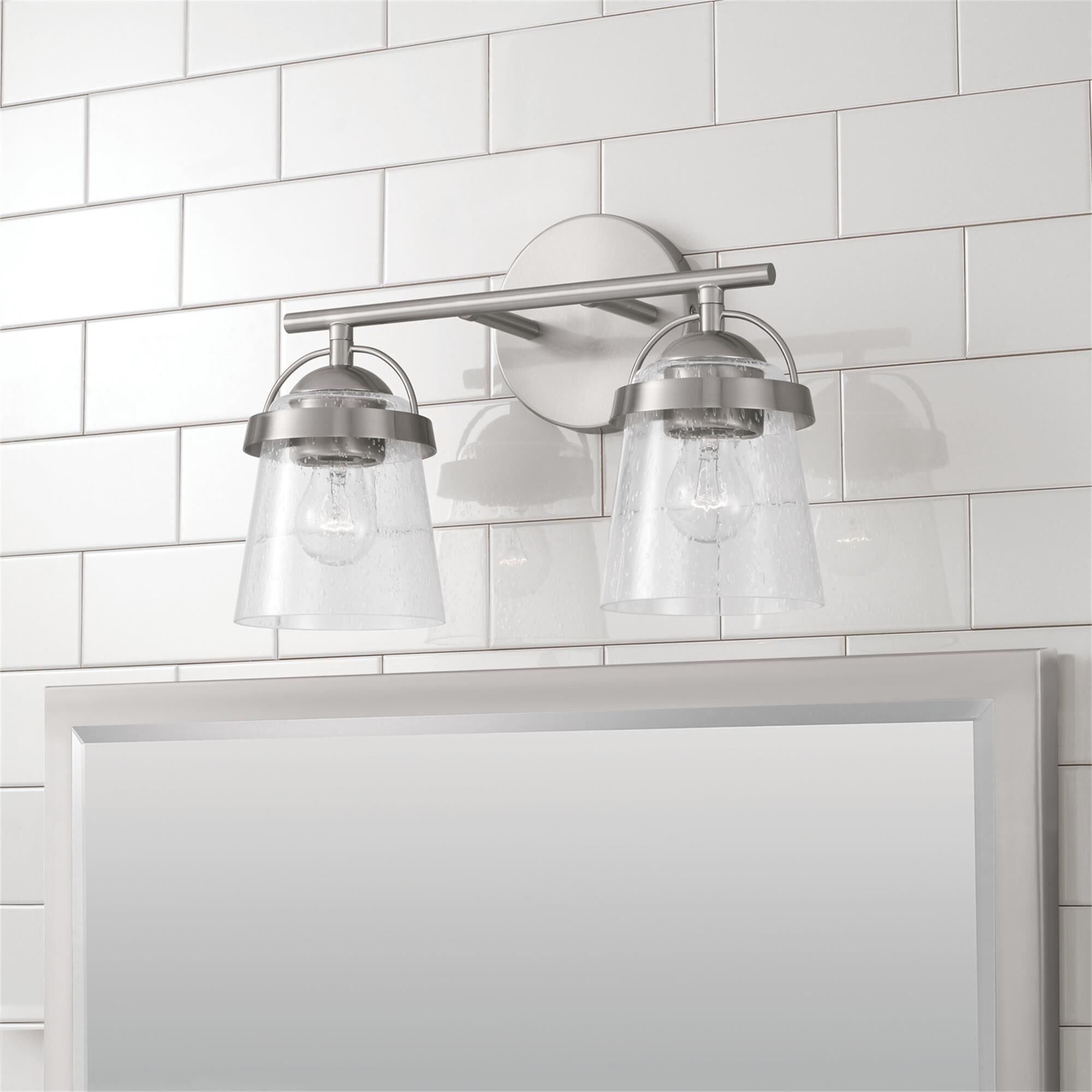Shown in Brushed Nickel finish and Clear Seeded glass
