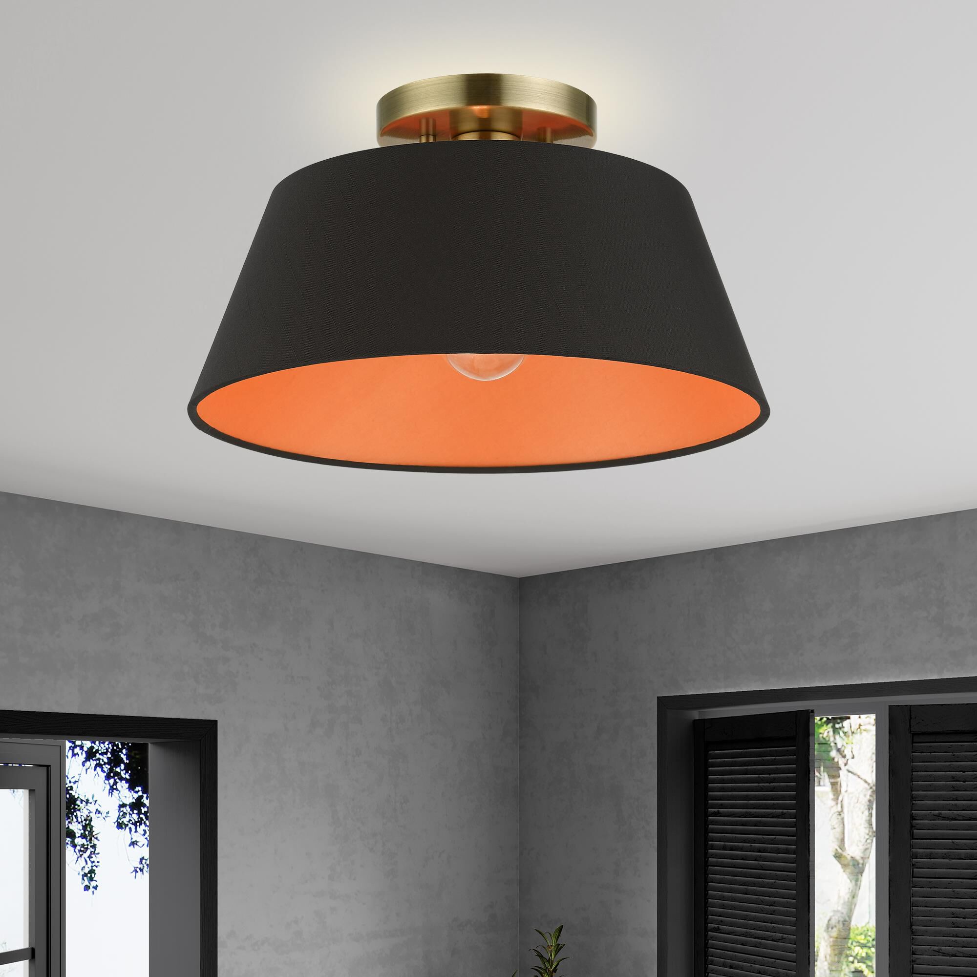 Shown in Antique Brass finish and Black Fabric Hardback with Orange Fabric Inside shade