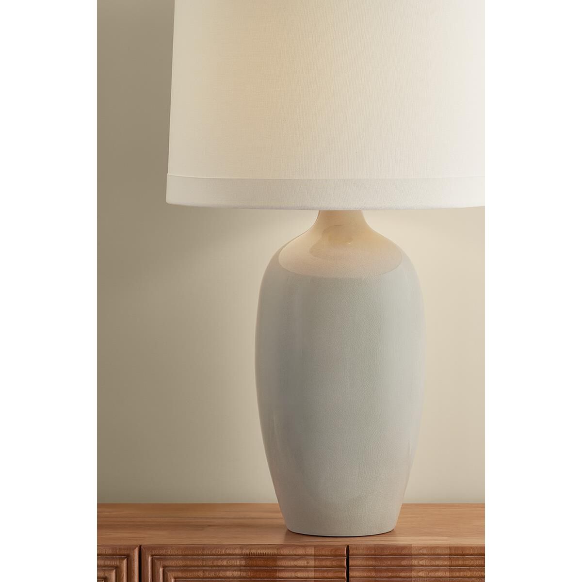 Shown in Aged Brass and Ceramic Frost Grey Crackle finish and White Linen shade