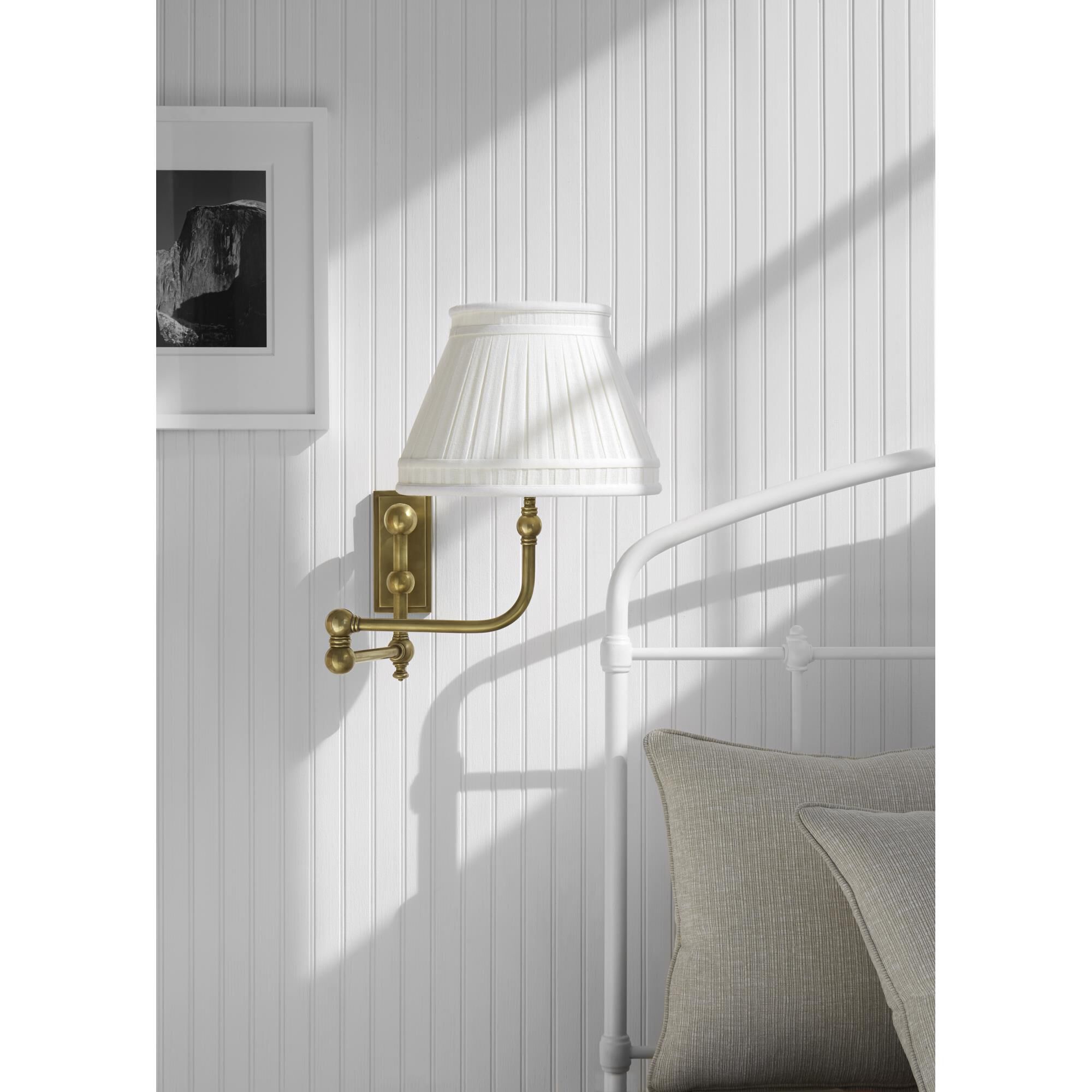 Shown in Antique-Burnished Brass finish and Linen Collar shade