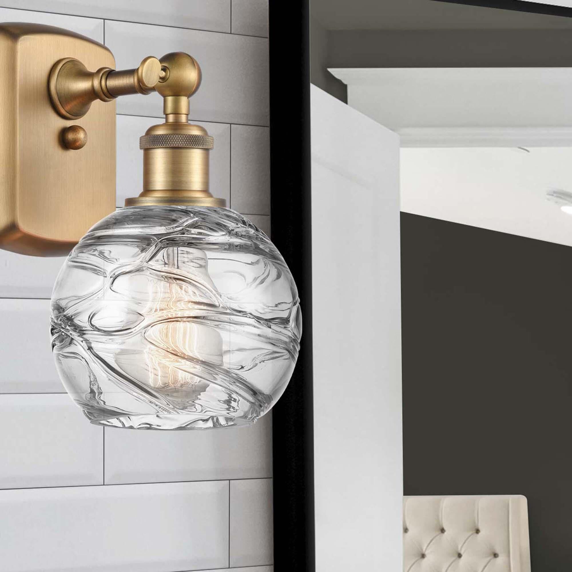 Shown in Brushed Brass finish and Sphere glass and Glass shade