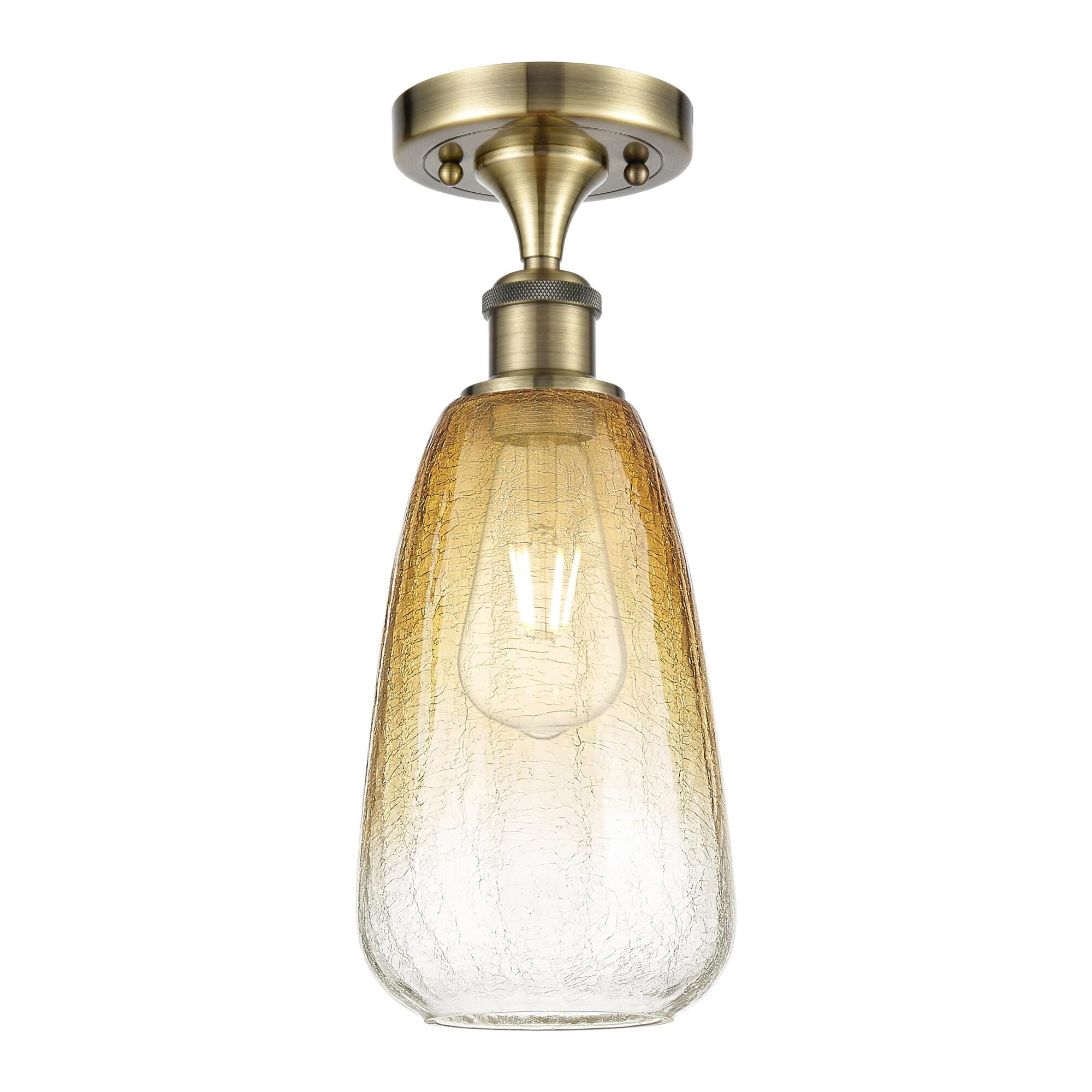 Shown in Antique Brass finish and Amber glass