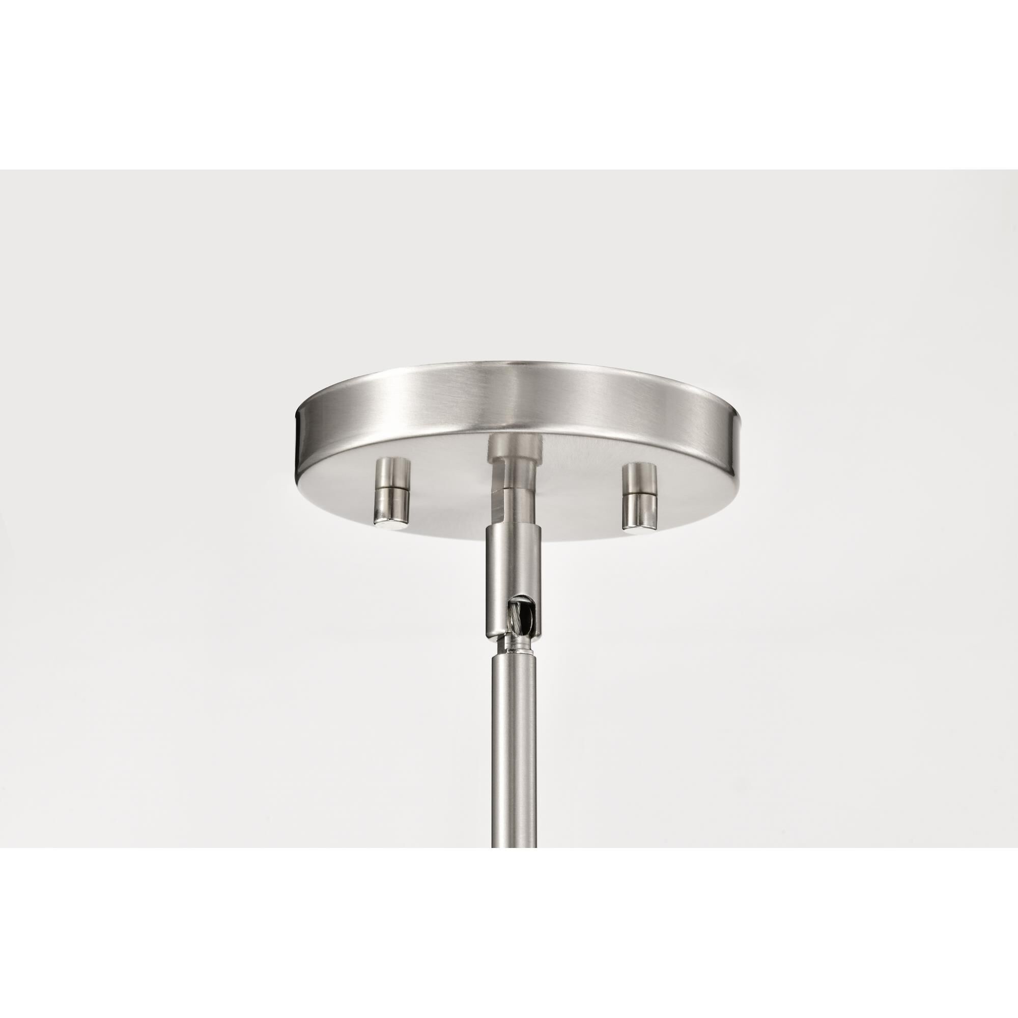 Shown in Brushed Nickel finish and Ribbed White glass