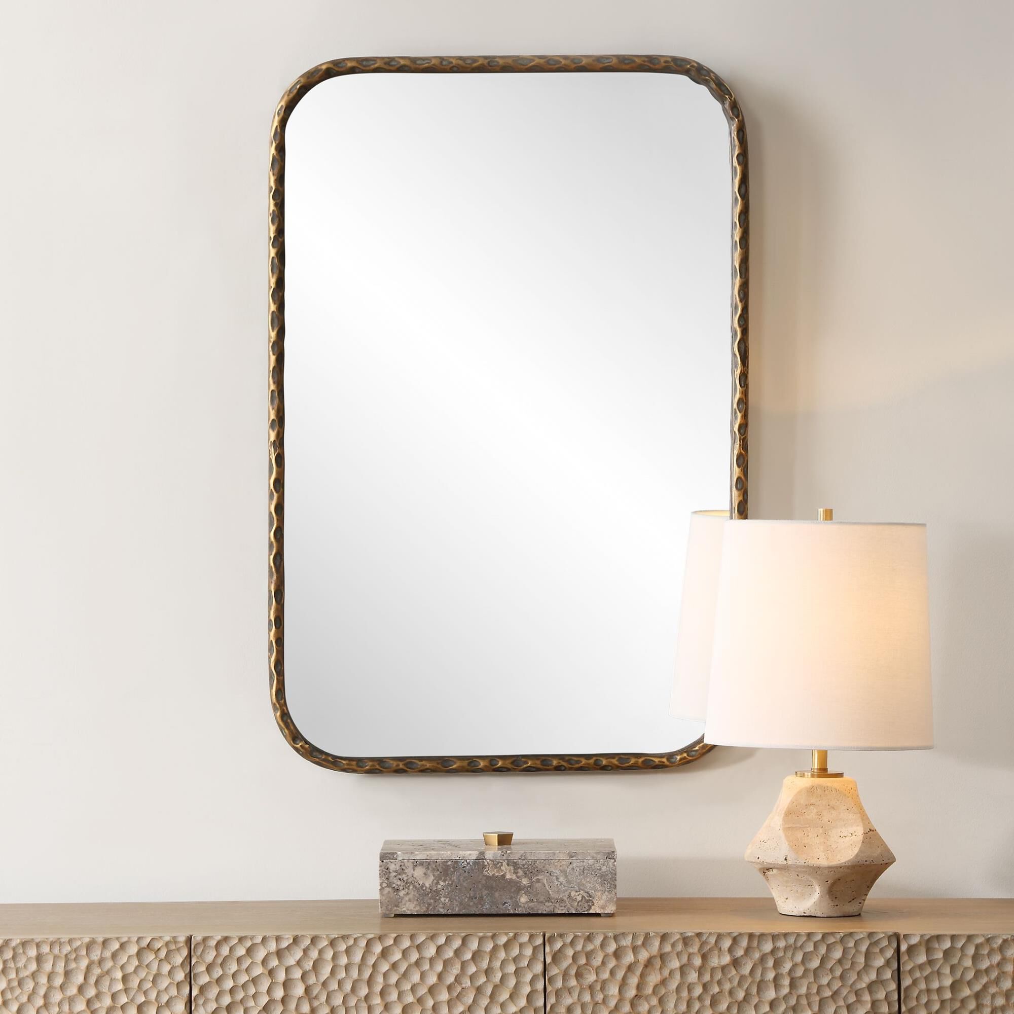 Shown in This Vanity Mirror Features A Hammered Textured Iron Frame Finished In An Aged Bronze With Intricate finish