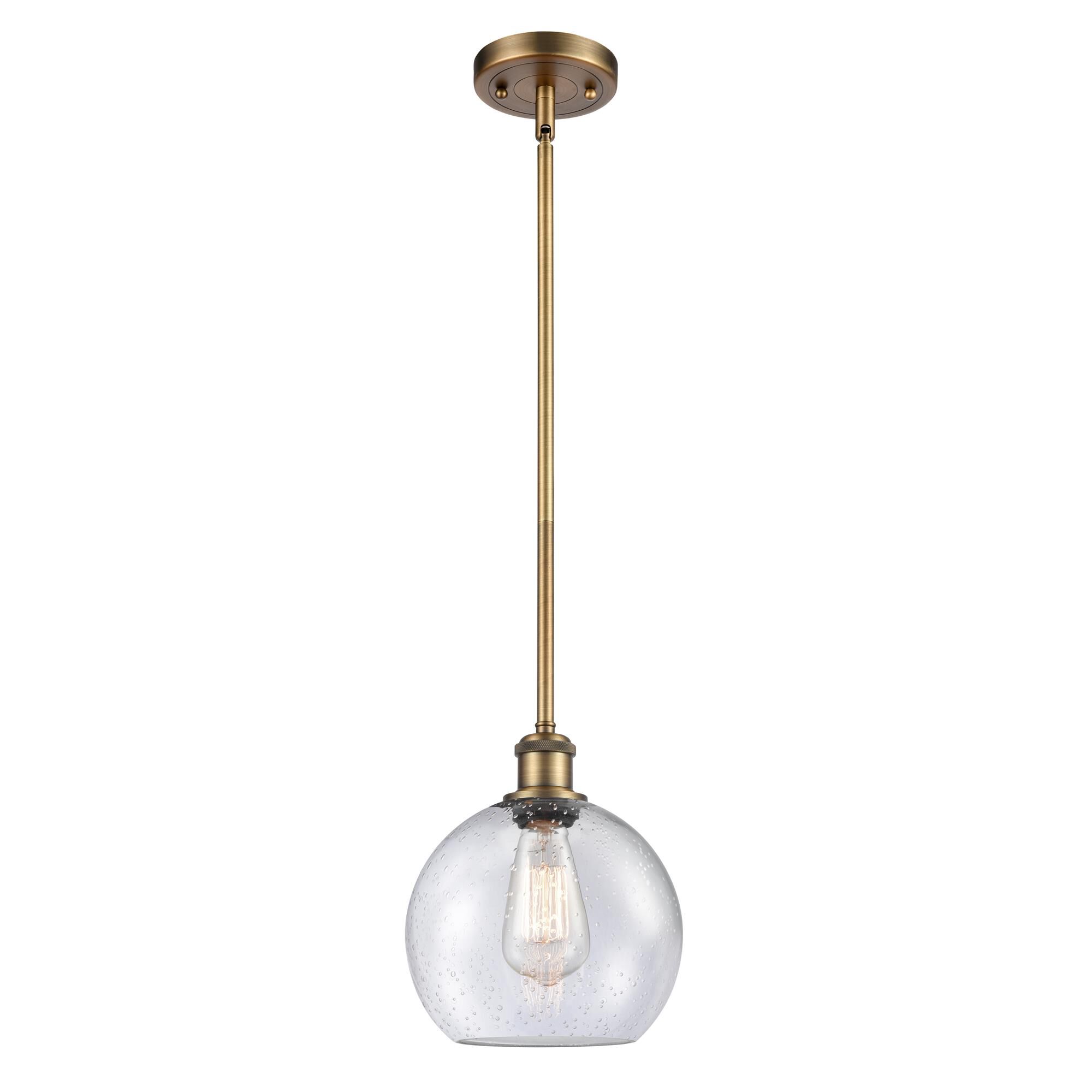 Shown in Brushed Brass finish and Cased Matte White Seedy glass
