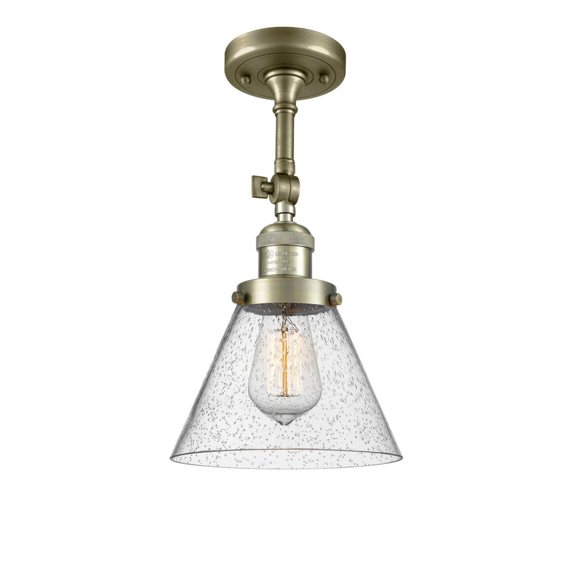Shown in Antique Brass finish and Seedy glass and Brushed Satin Nickel shade and No Accent accent