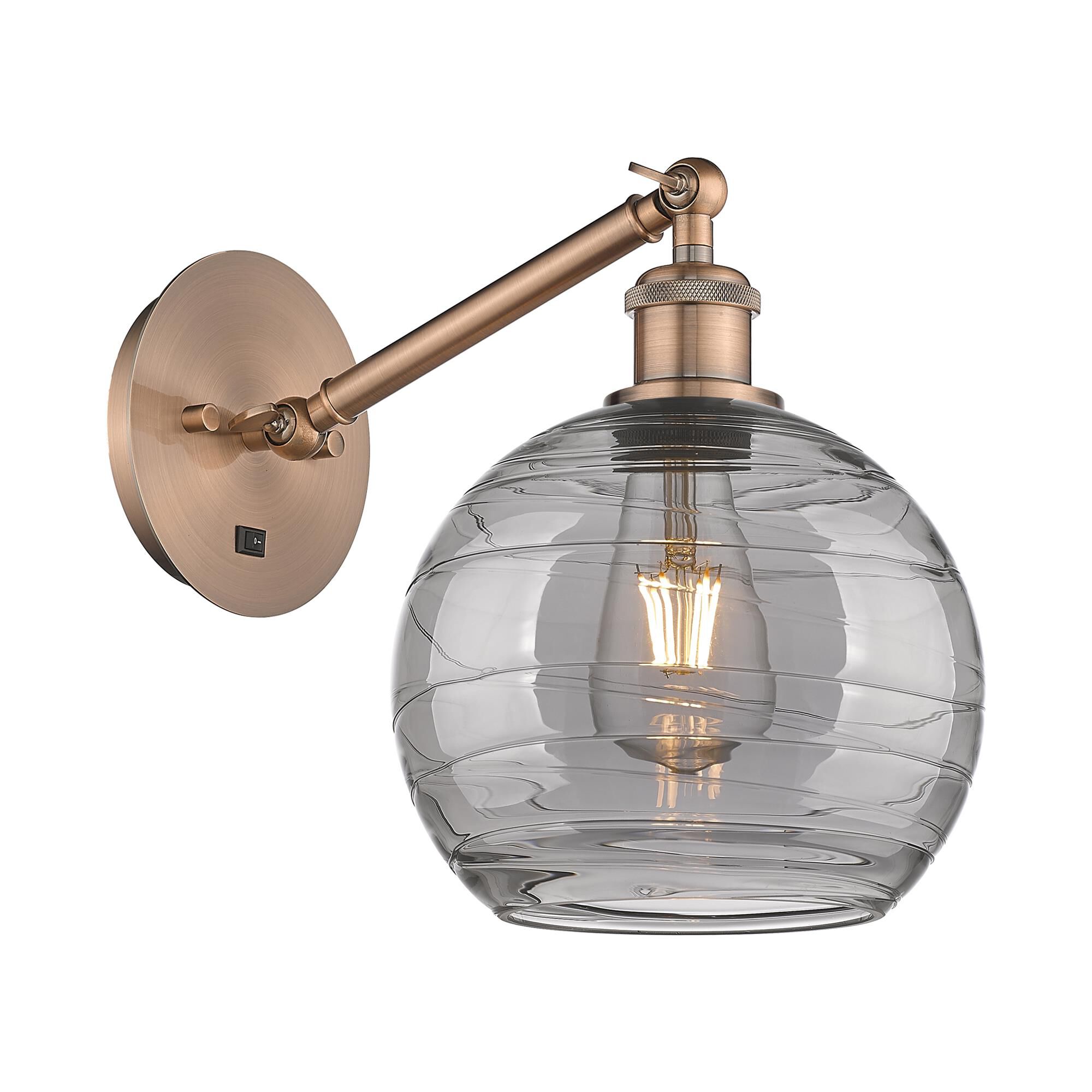 Shown in Antique Copper finish and Light Smoke Deco Swirl glass