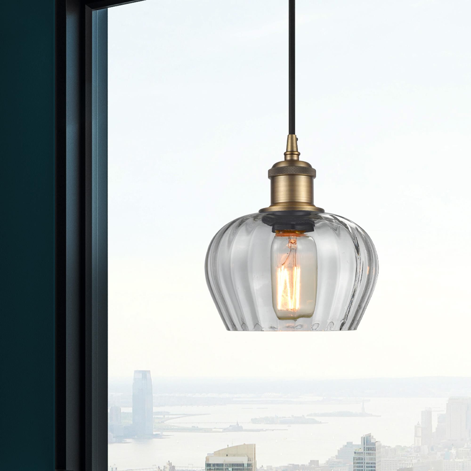 Shown in Brushed Brass finish and Clear Fenton glass and Matte Black Smithfield shade and Polished Chrome accent