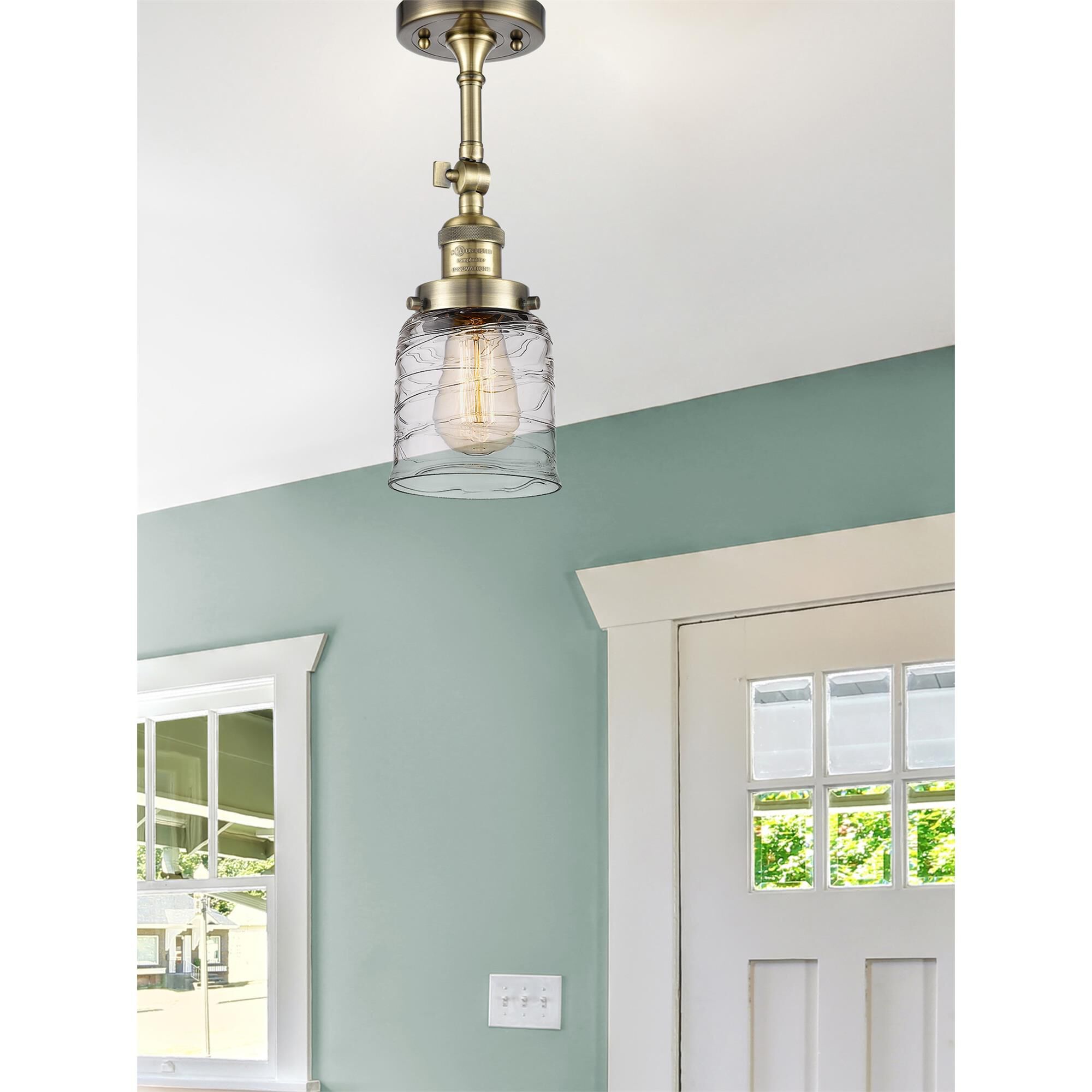 Shown in Antique Brass finish and Clear glass