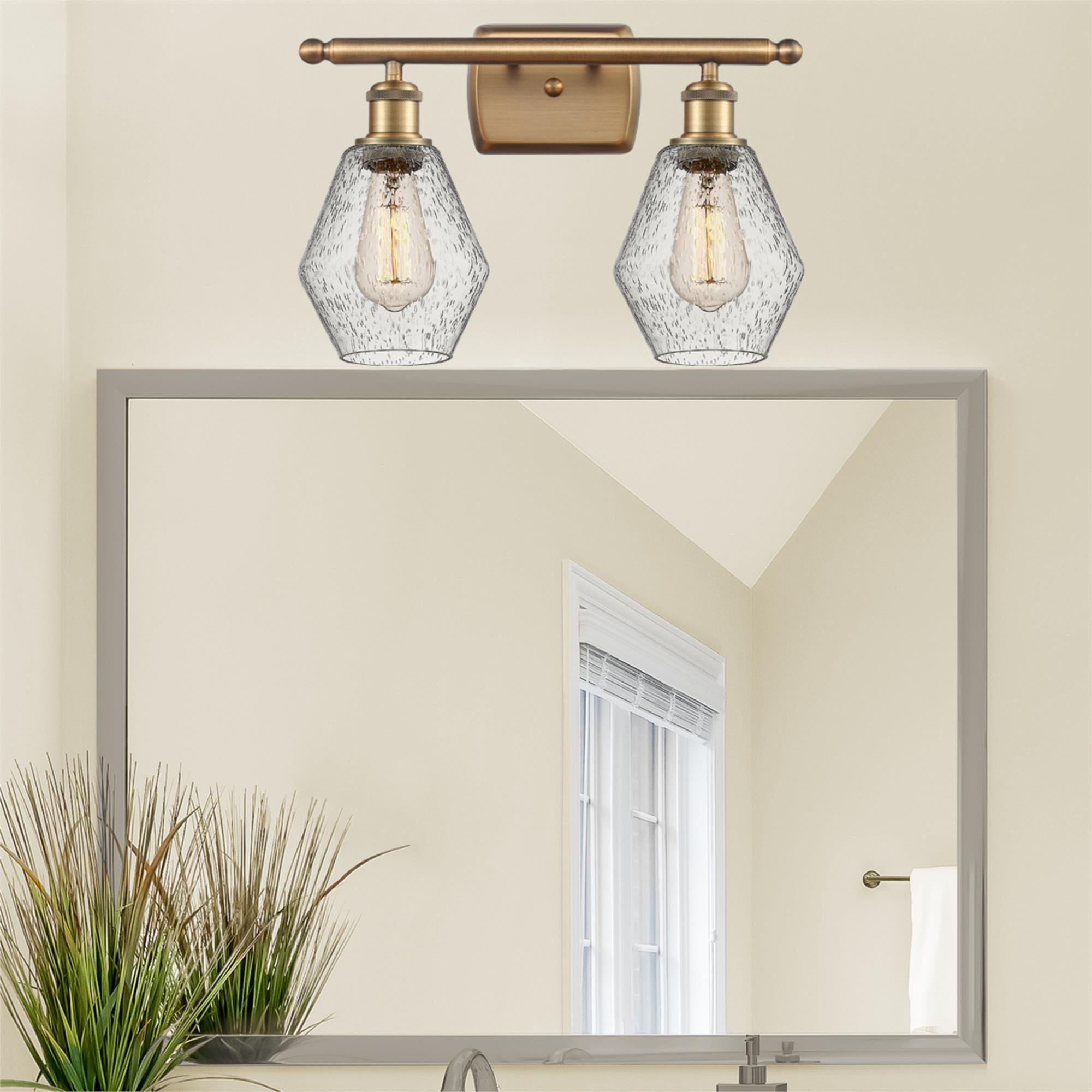 Shown in Brushed Brass  finish and Seedy glass