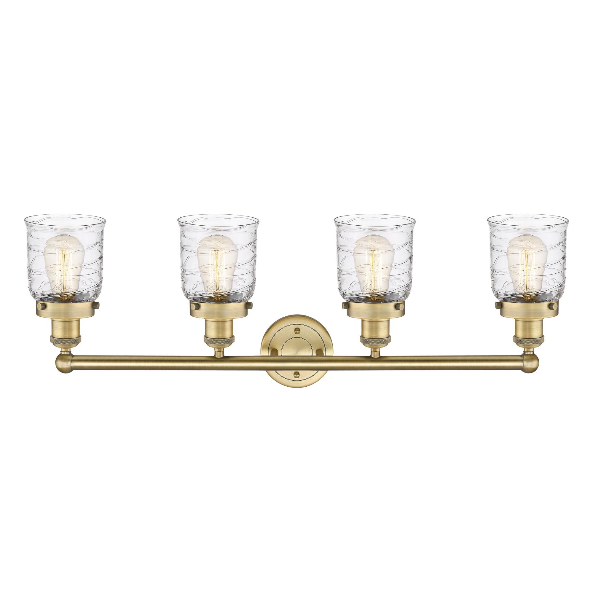 Shown in Brushed Brass finish and Clear Deco Swirl glass