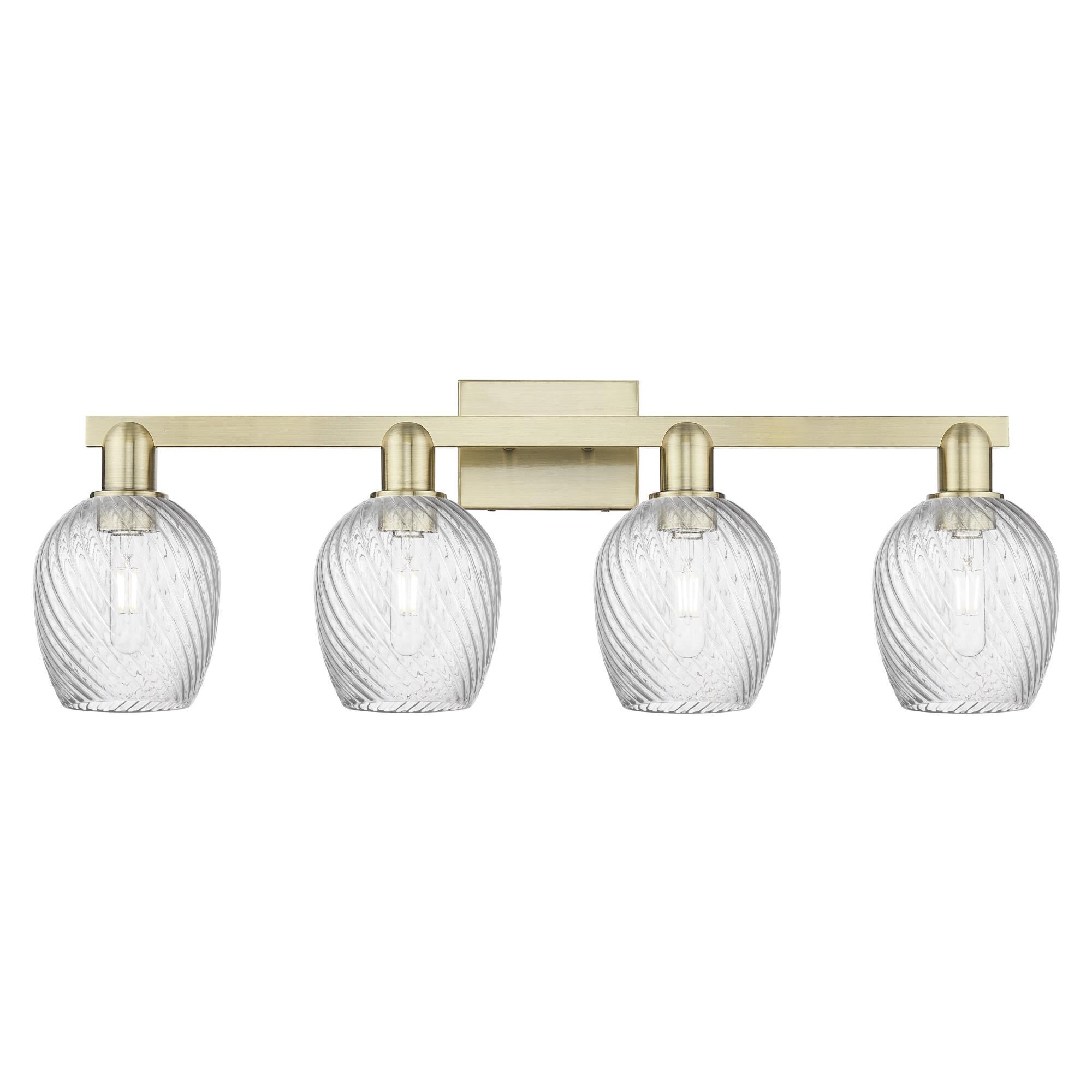 Shown in Antique Brass finish and Clear Spiral Fluted glass