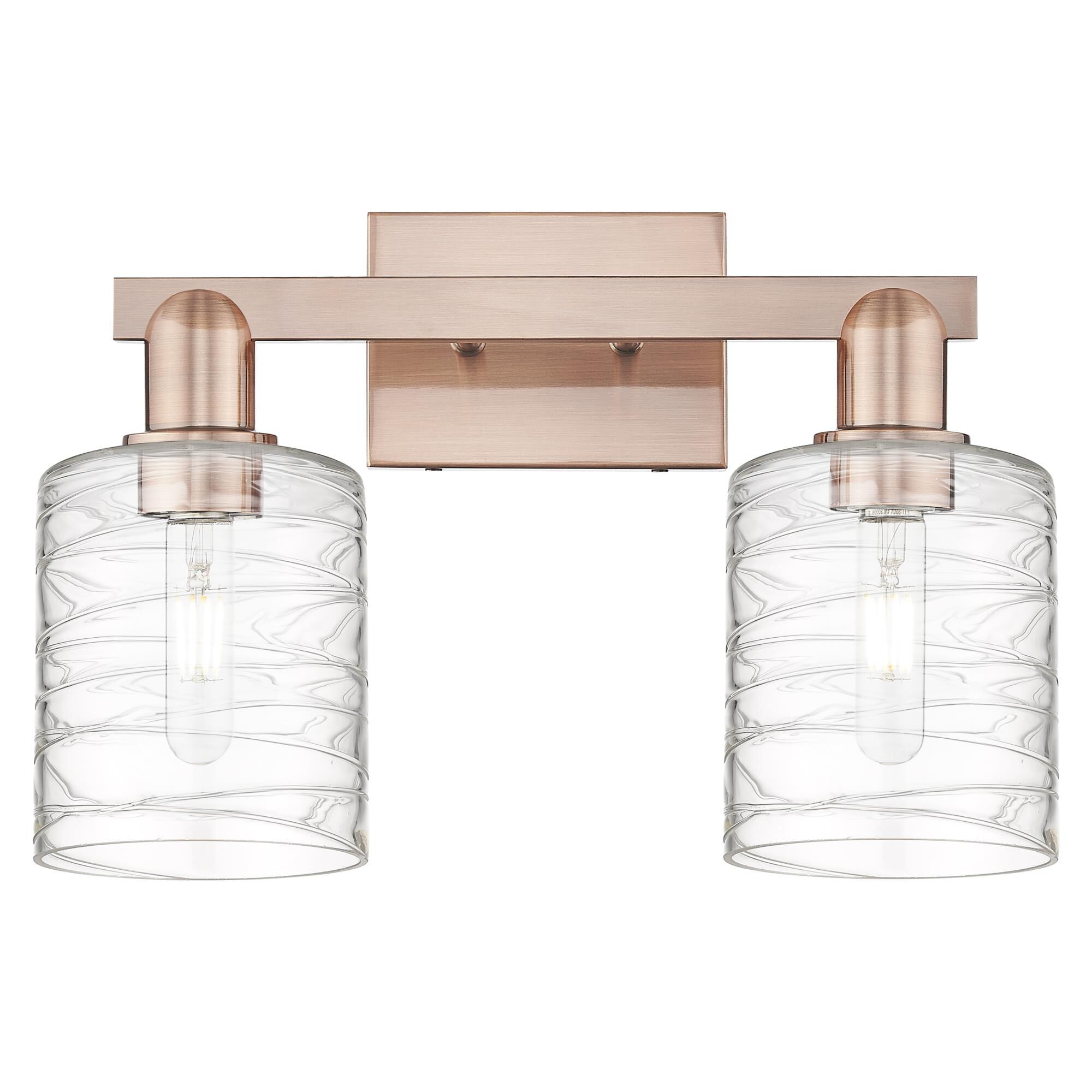 Shown in Antique Copper finish and Deco Swirl glass