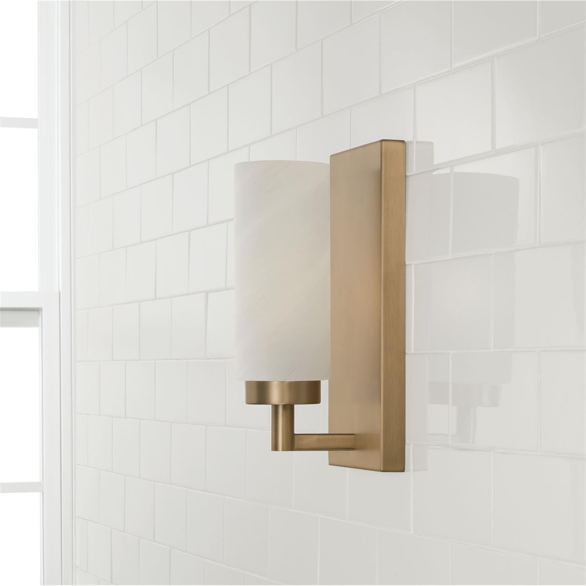 Shown in Aged Brass finish and Faux Alabaster glass