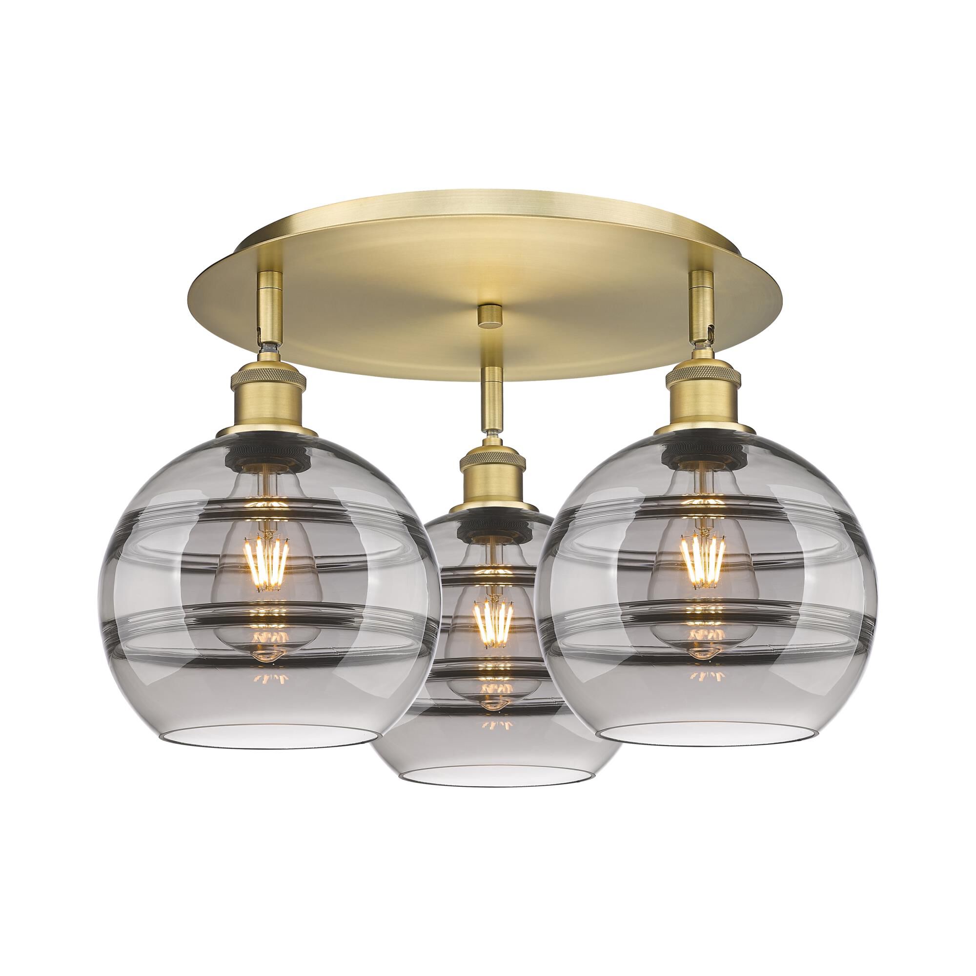 Shown in Brushed Brass finish and Light Smoke glass