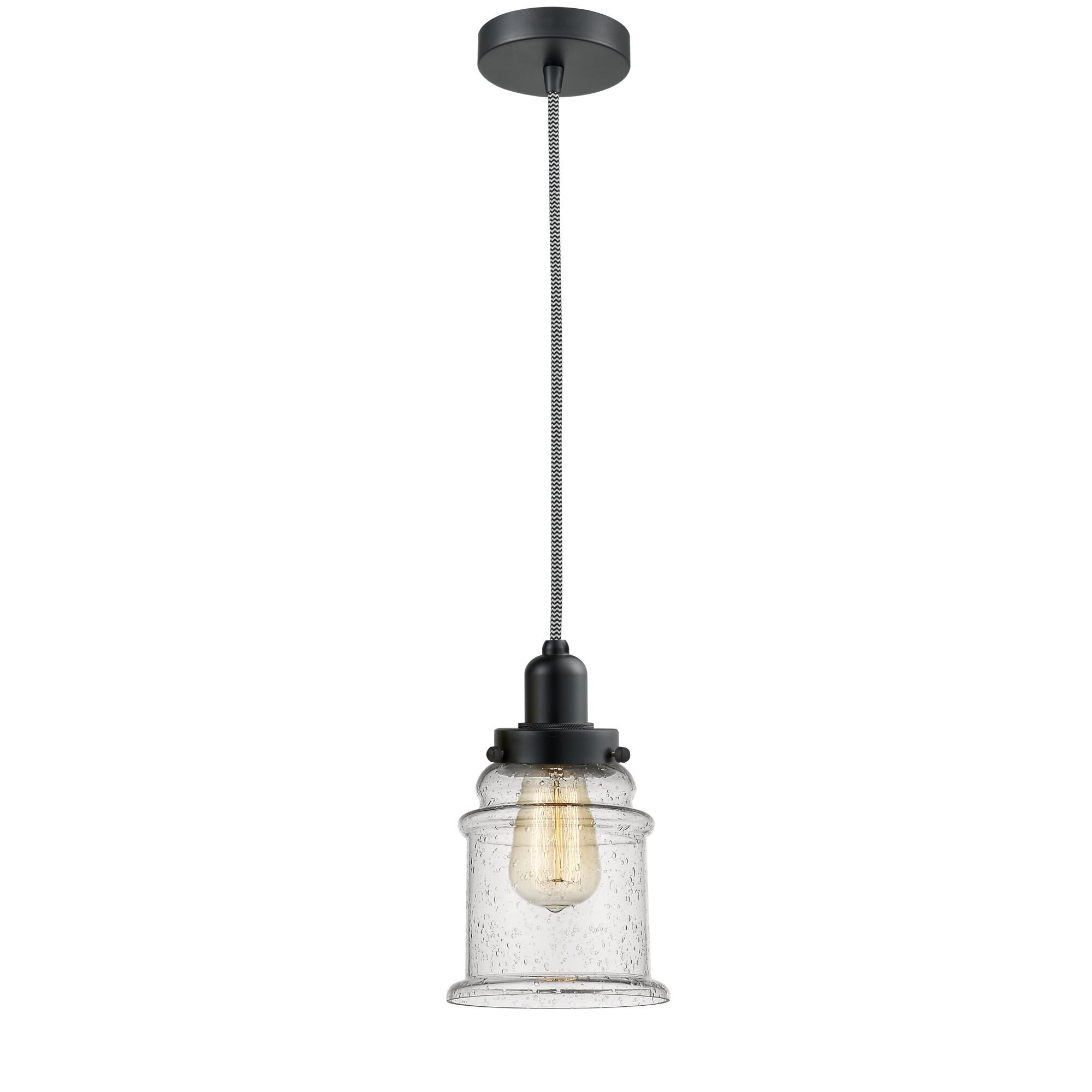 Shown in Matte Black finish and Bell glass and Glass shade and Matte Black Whitney Socket Cover accent