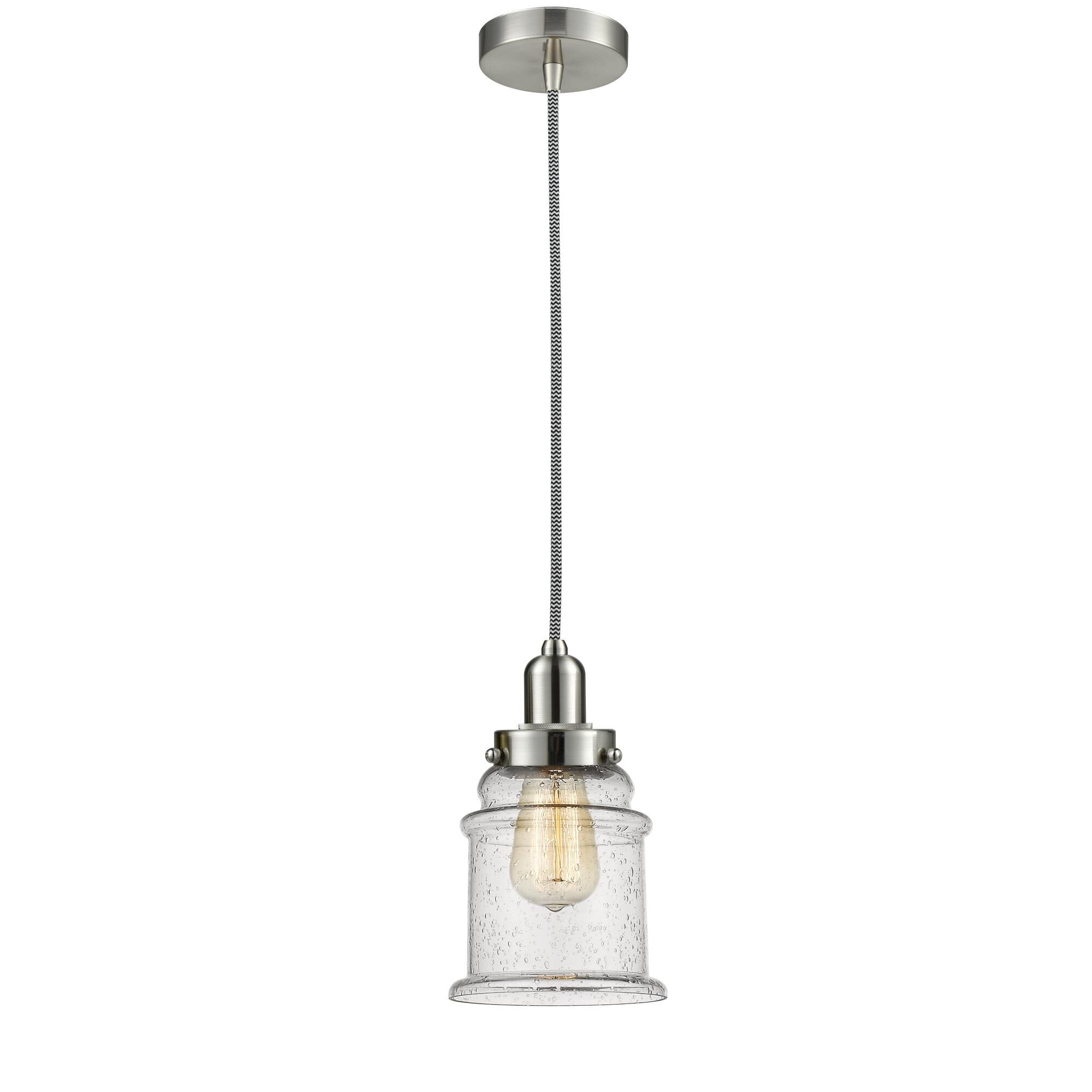 Shown in Satin Nickel finish and Bell glass and Glass shade and Satin Nickel Whitney Socket Cover accent