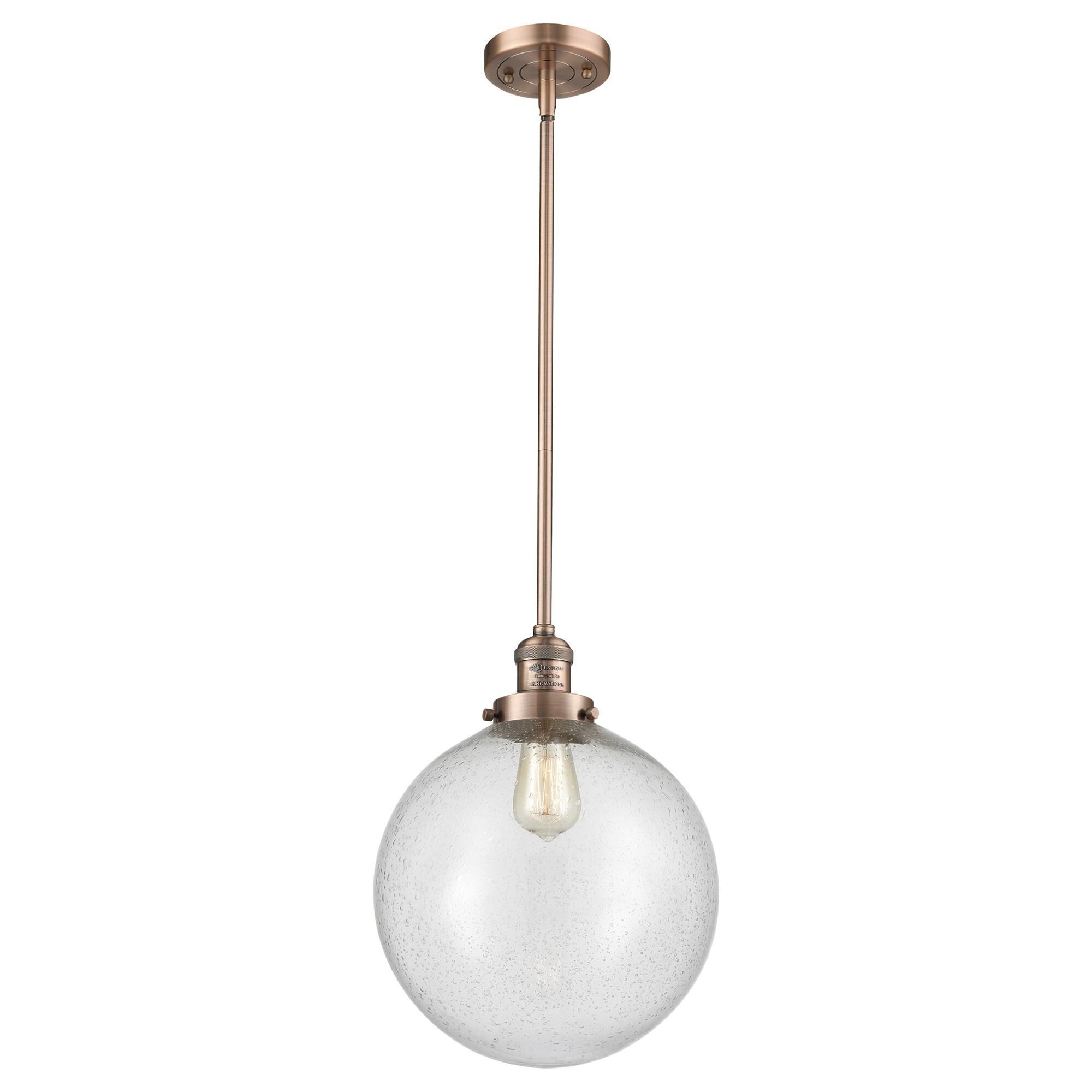 Shown in Antique Copper finish and Seedy Beacon glass