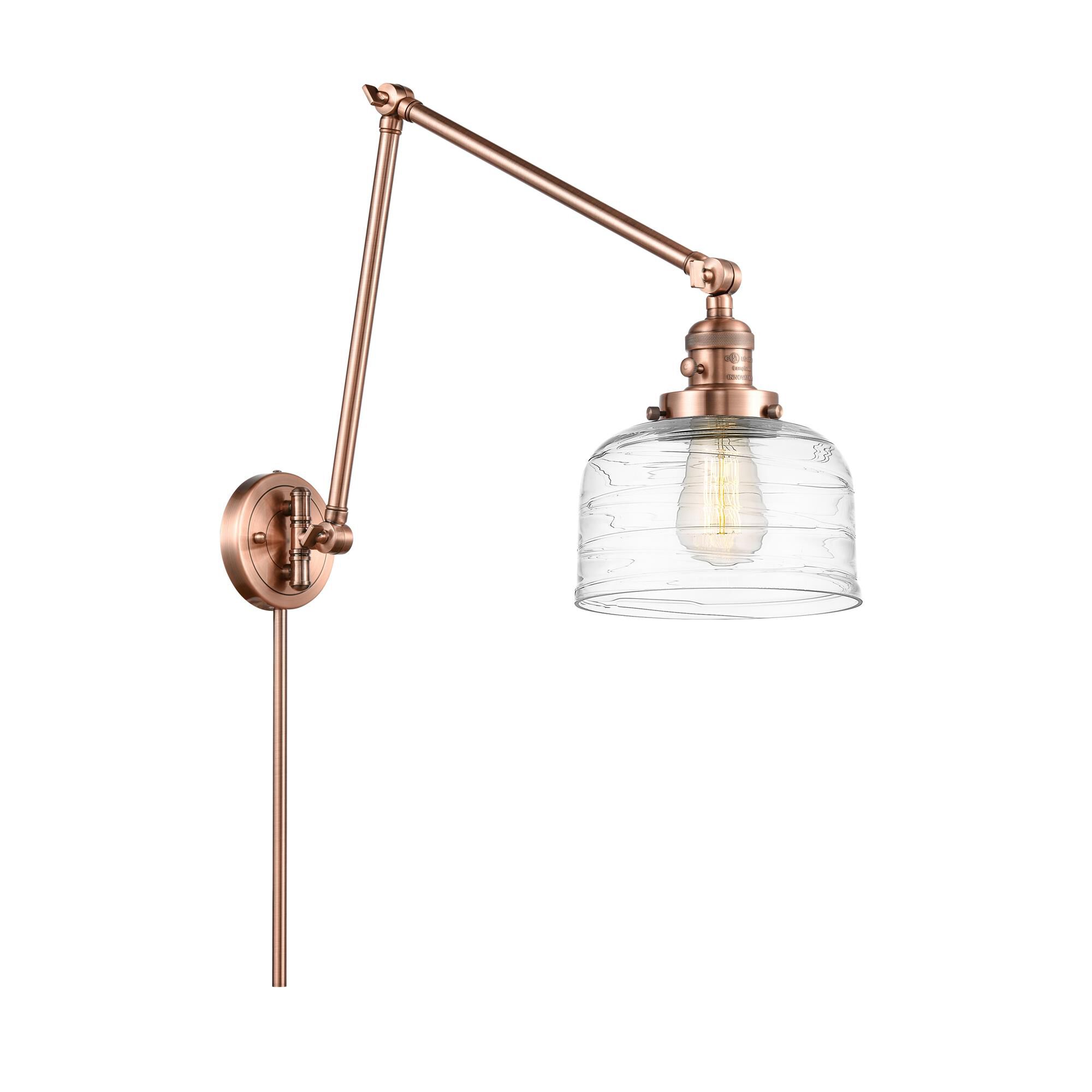 Shown in Antique Copper finish and Clear Deco Swirl Large Bell glass