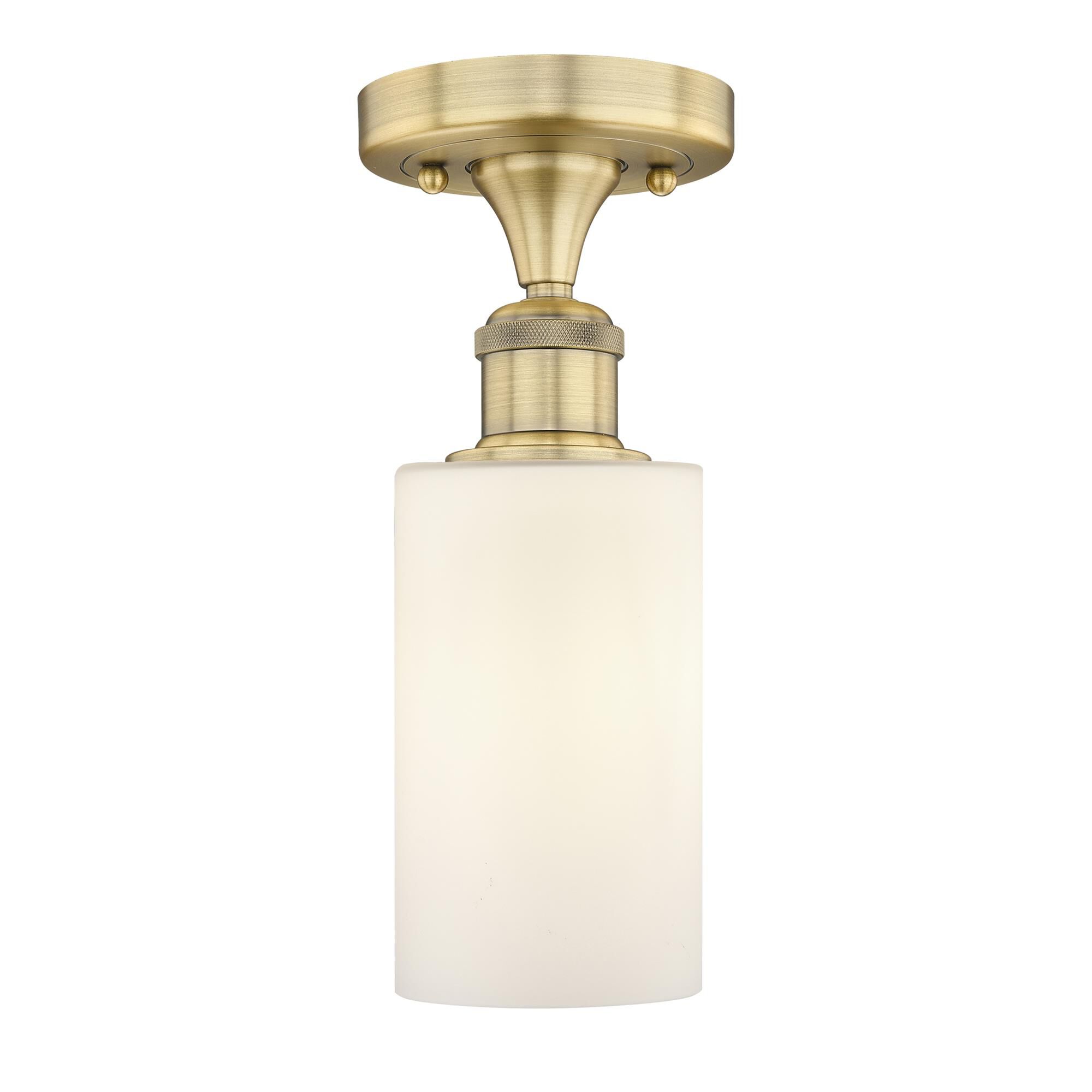 Shown in Brushed Brass finish and Matte White glass