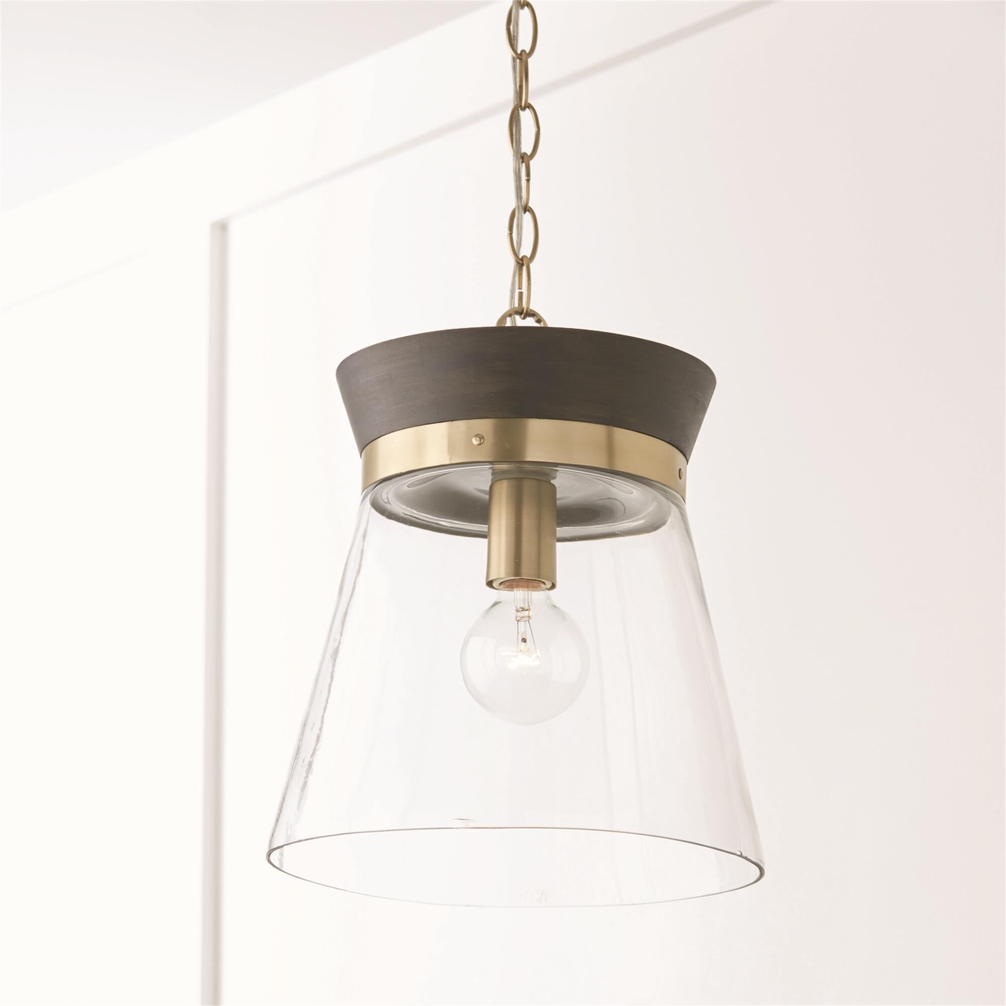 Shown in Black Stain and Matte Brass finish and Clear glass