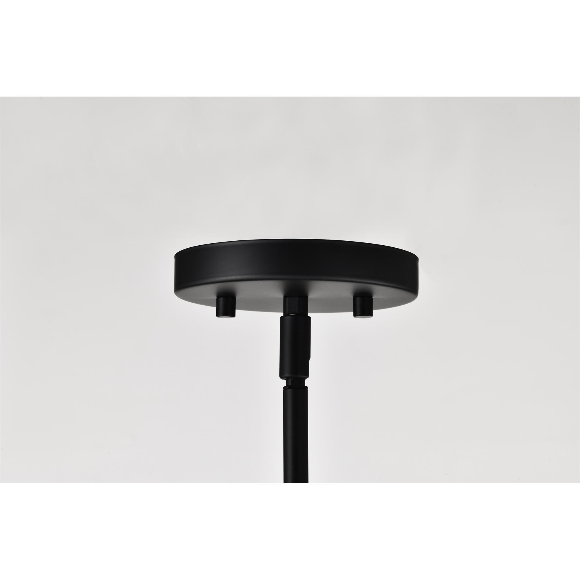 Shown in Matte Black finish and Frosted Ribbed glass