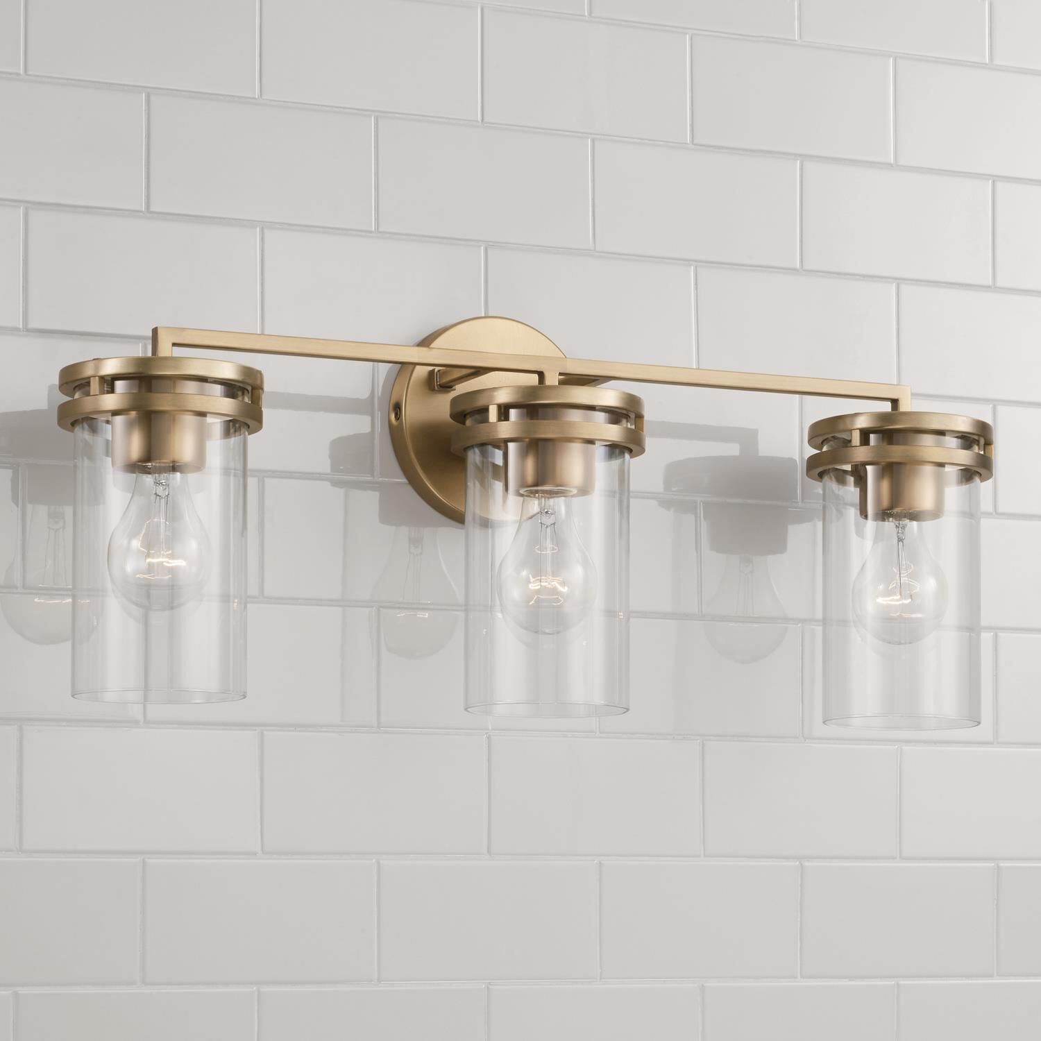 Shown in Aged Brass finish and Clear glass