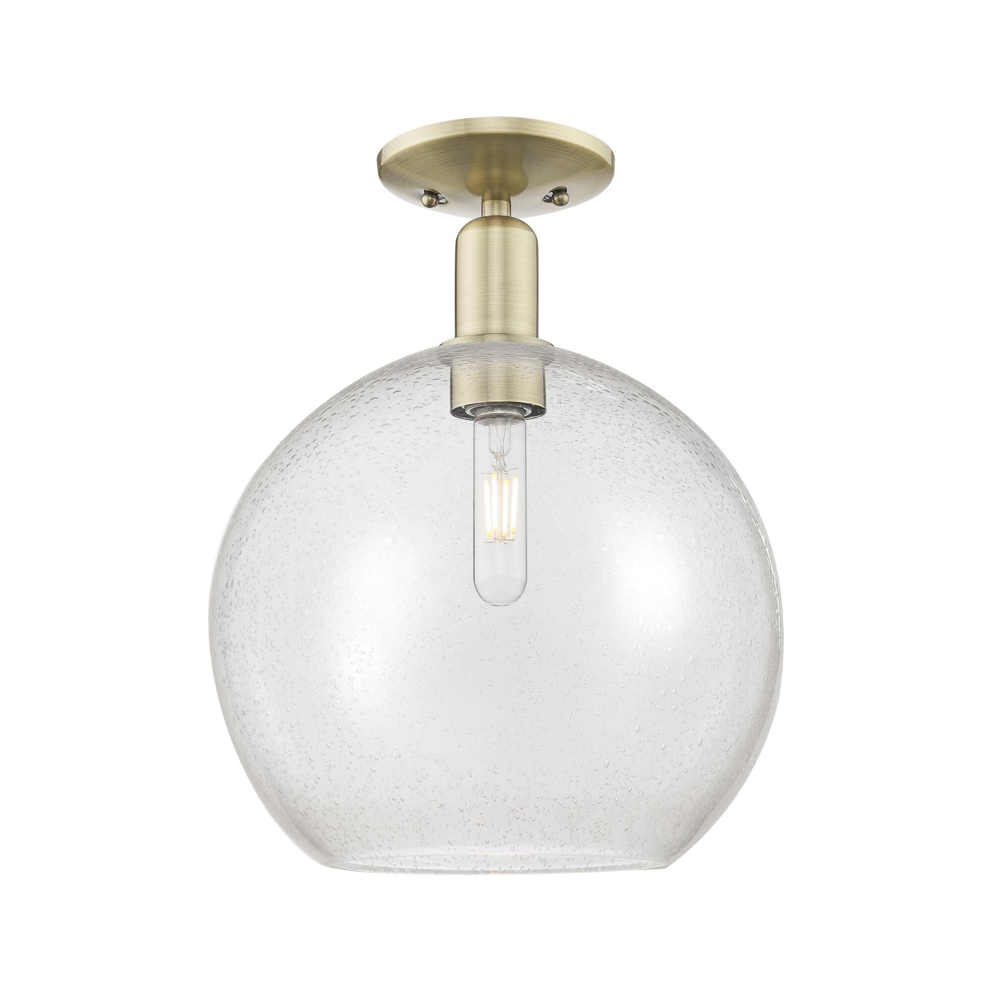 Shown in Antique Brass finish and Seedy glass