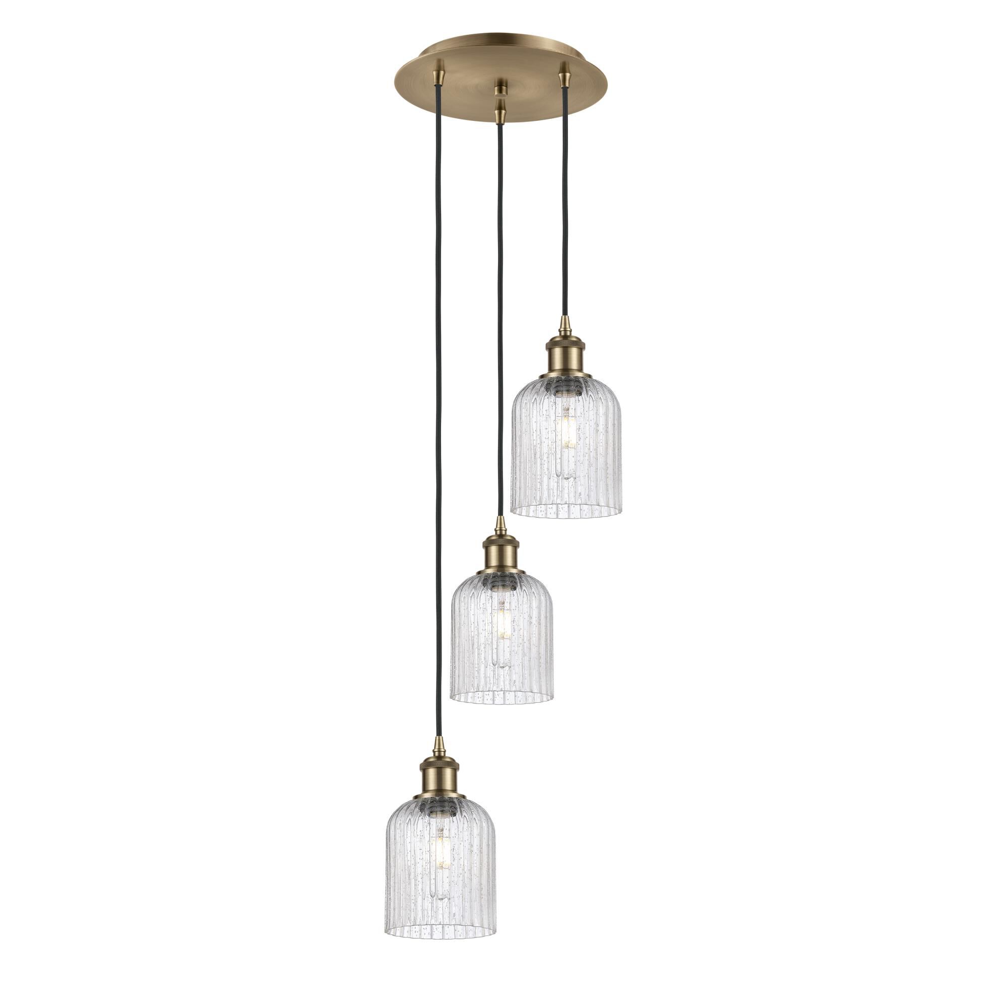 Shown in Antique Brass finish and Seedy shade