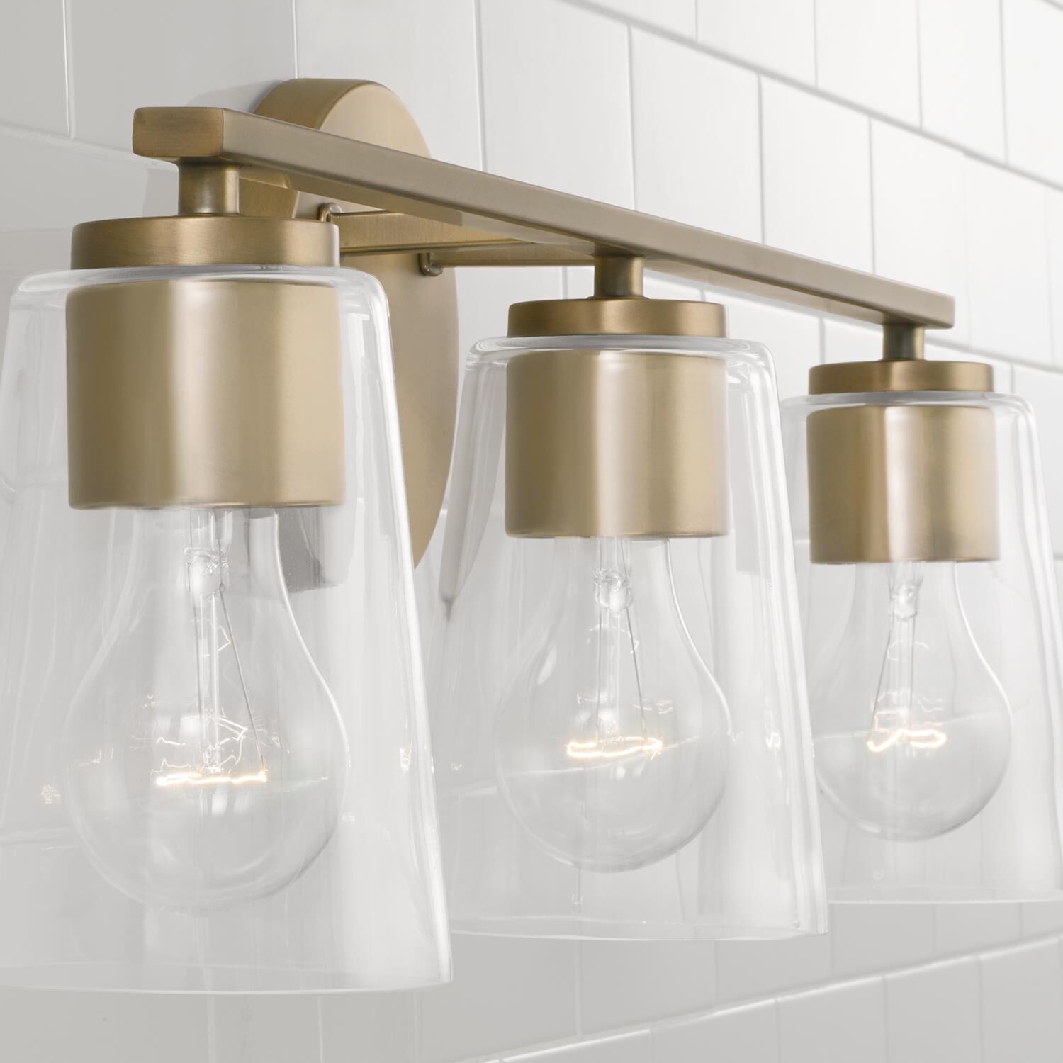 Shown in Aged Brass finish and Clear glass