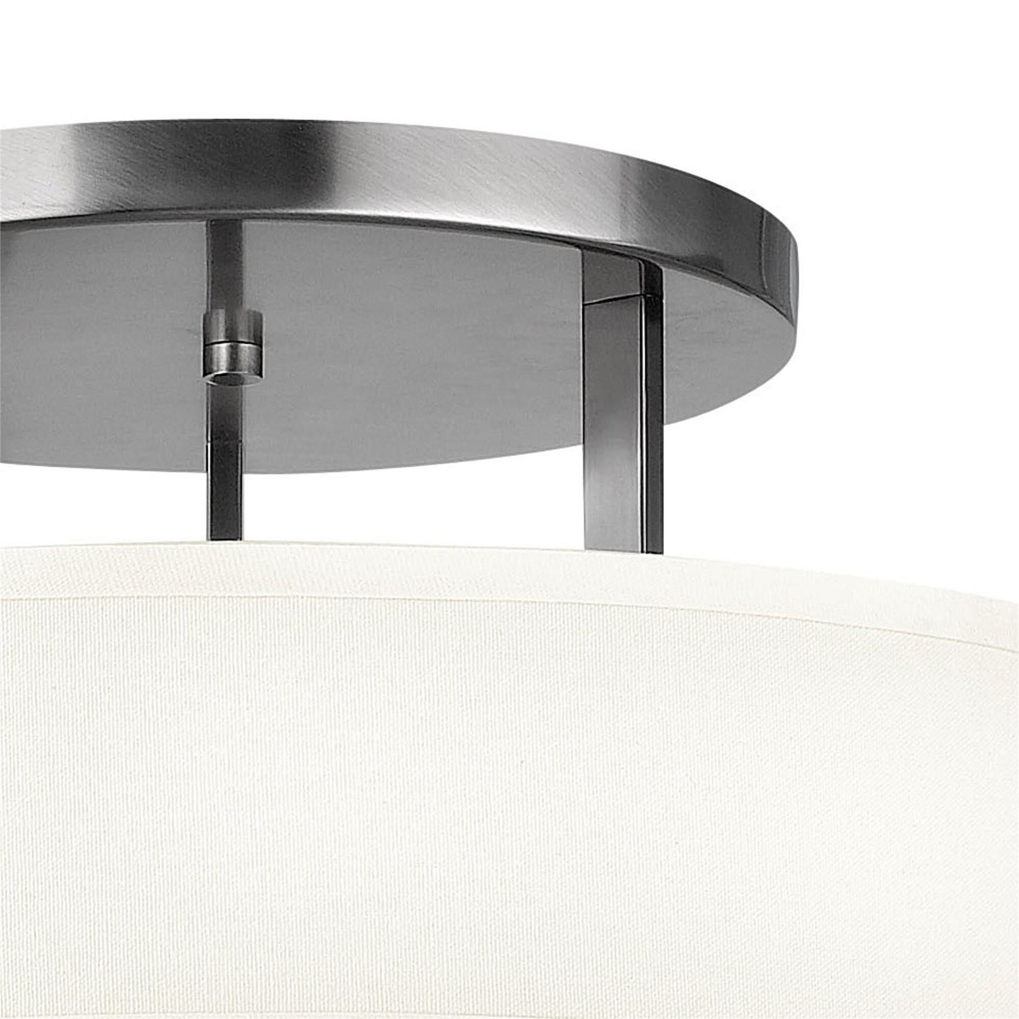 Shown in Antique Nickel finish and Off-White Linen Hardback shade