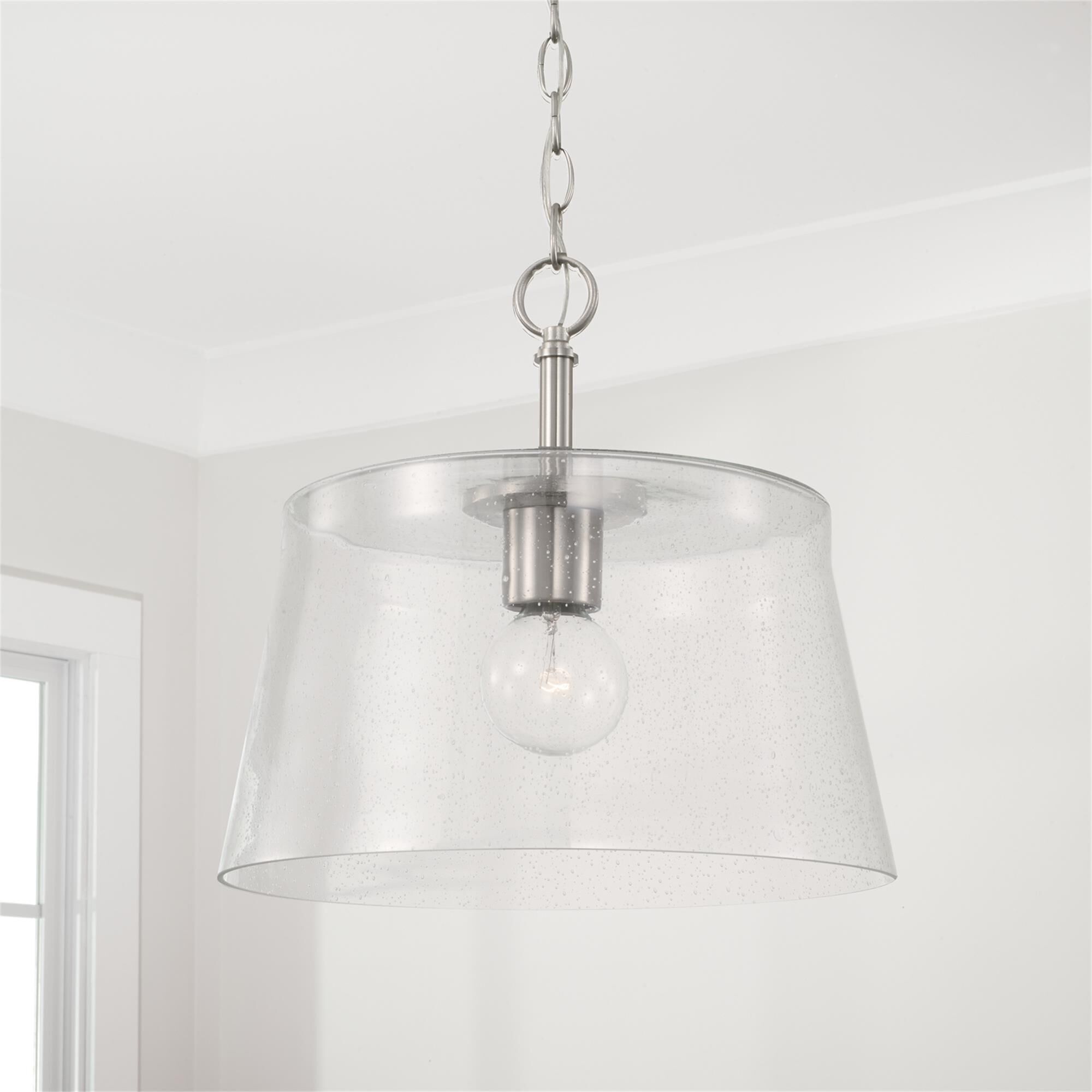 Shown in Brushed Nickel finish and Clear Seeded glass