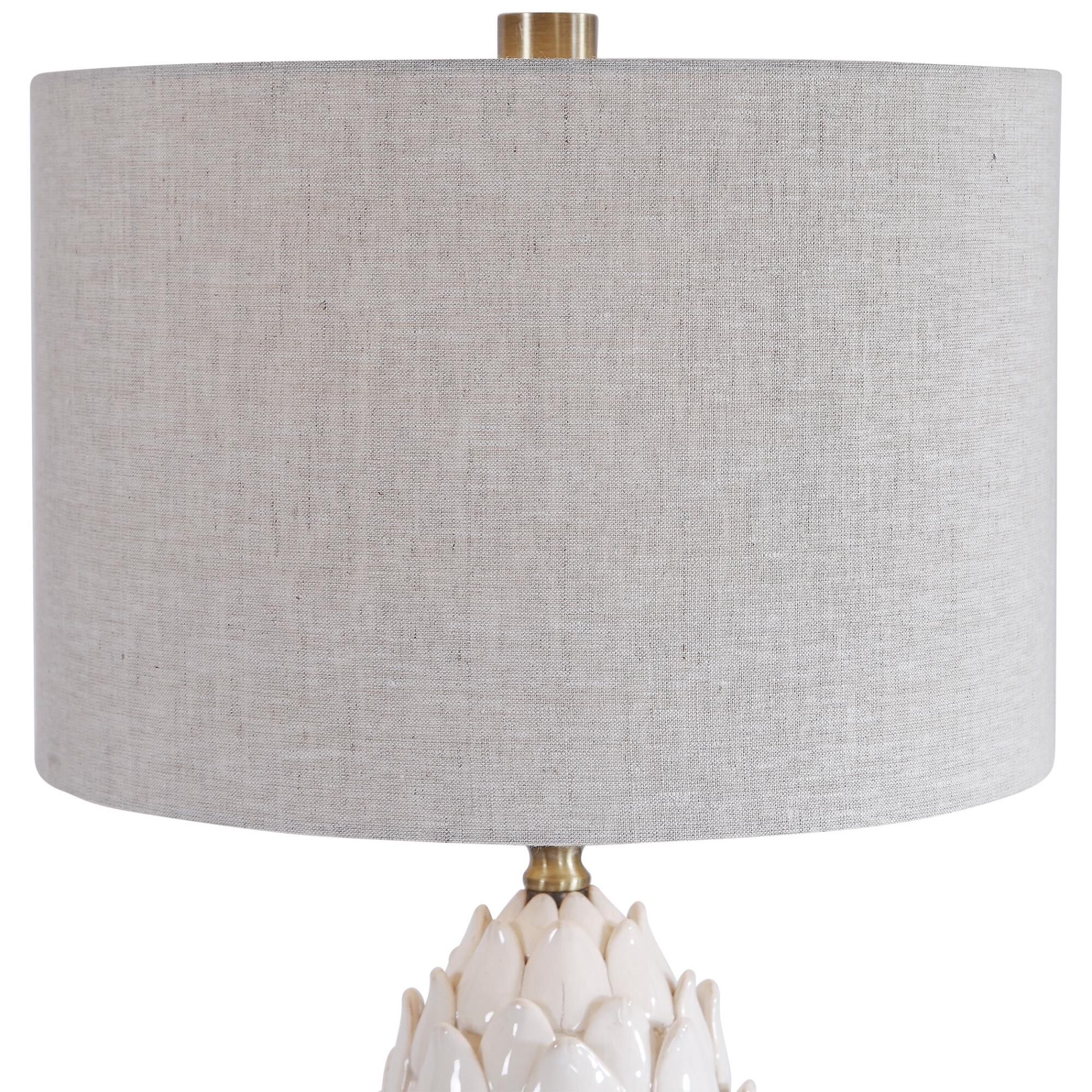 Shown in A White Ceramic Artichoke In A White Crackled Glaze With Aged Brown Tips Accents This Table Lamp. Br finish and Round Drum Hardback shade