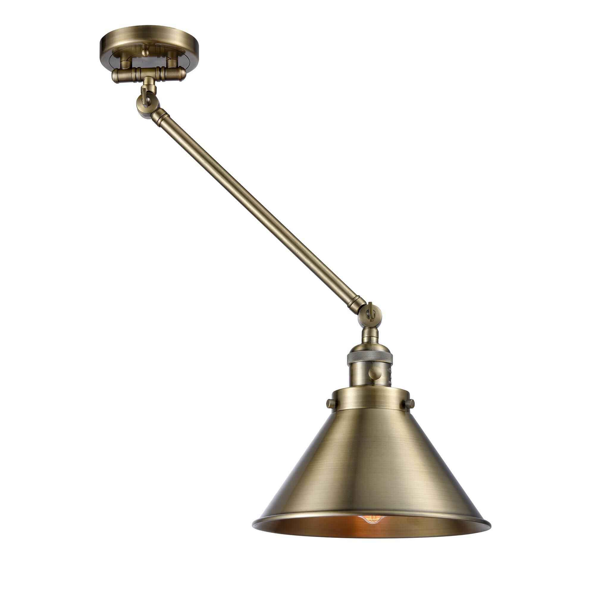 Shown in Antique Brass finish and Antique Brass shade