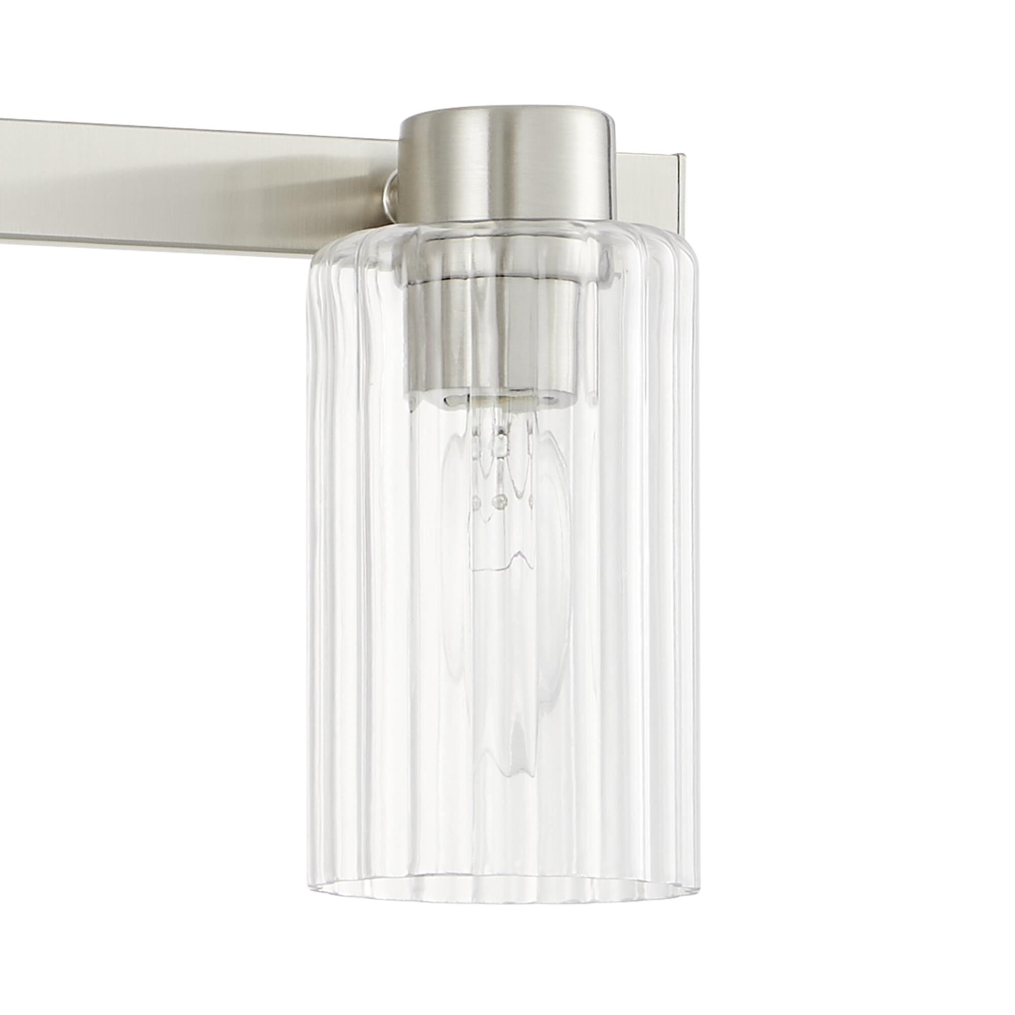 Shown in Brushed Nickel finish and Clear Ribbed glass