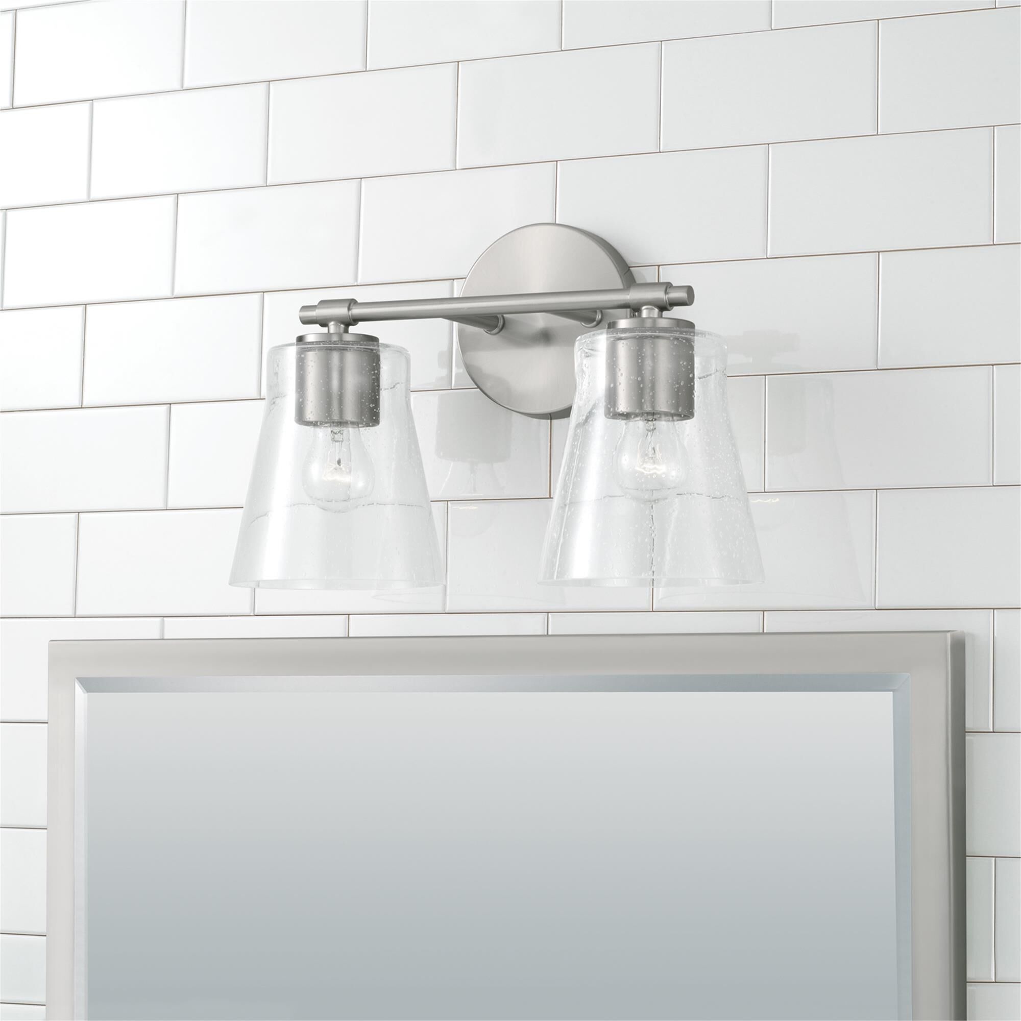 Shown in Brushed Nickel finish and Clear Seeded glass