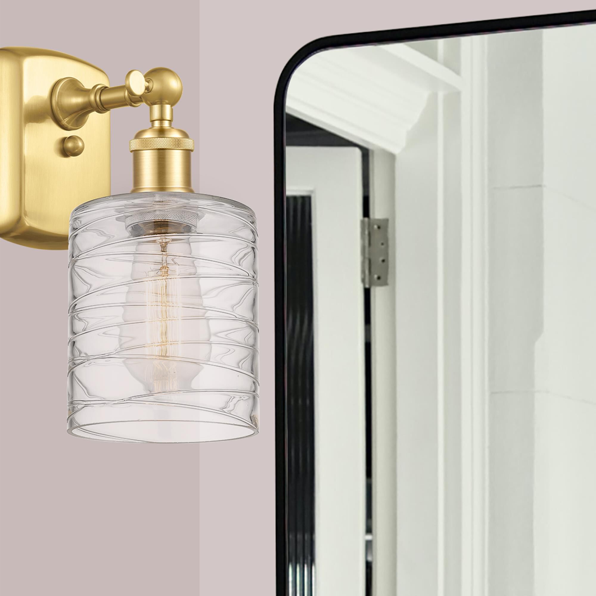 Shown in Satin Gold finish and Deco Swirl glass