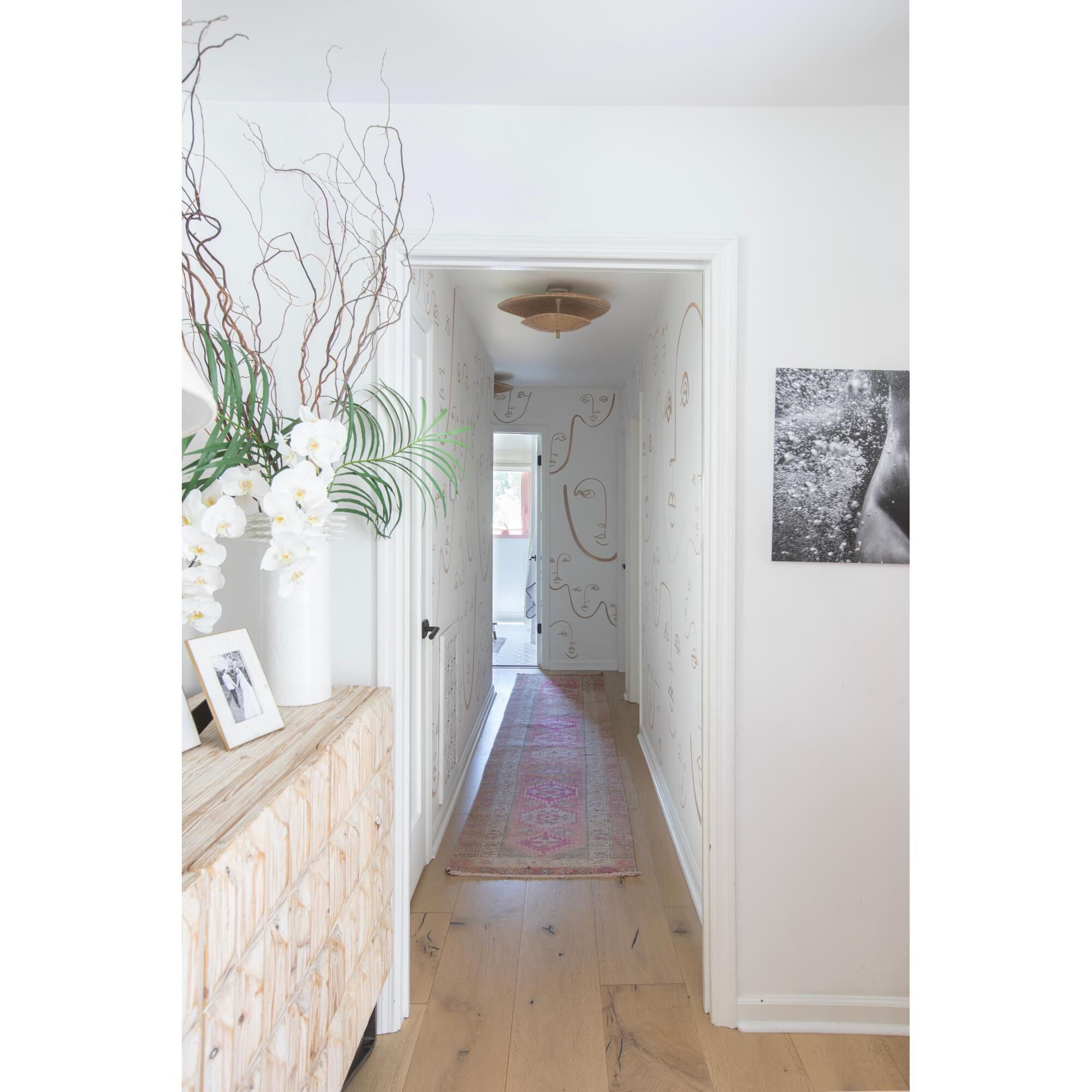 Shown in Aged Brass finish and Natural Woven shade