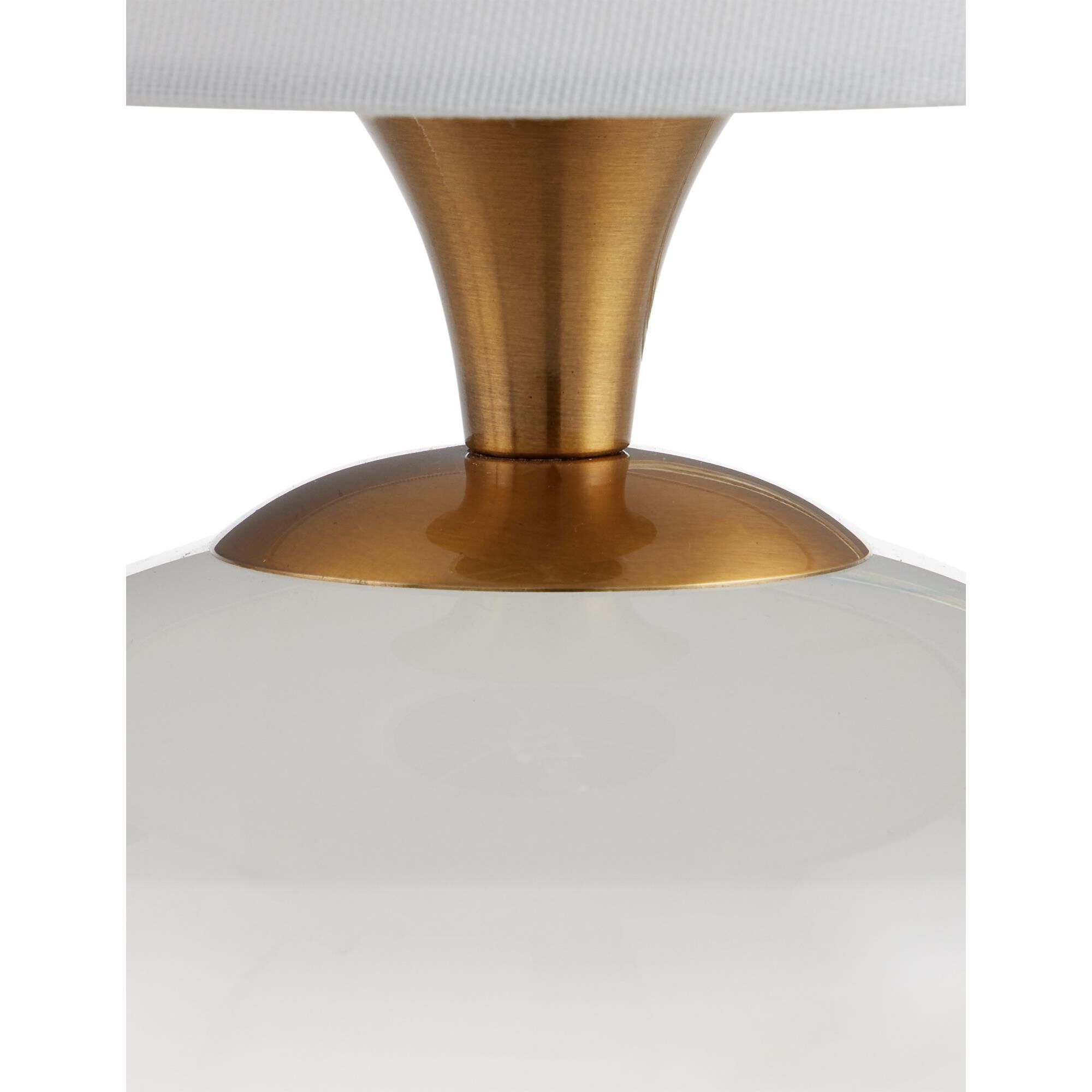 Shown in Clear, Antique Brass finish and White Linen shade