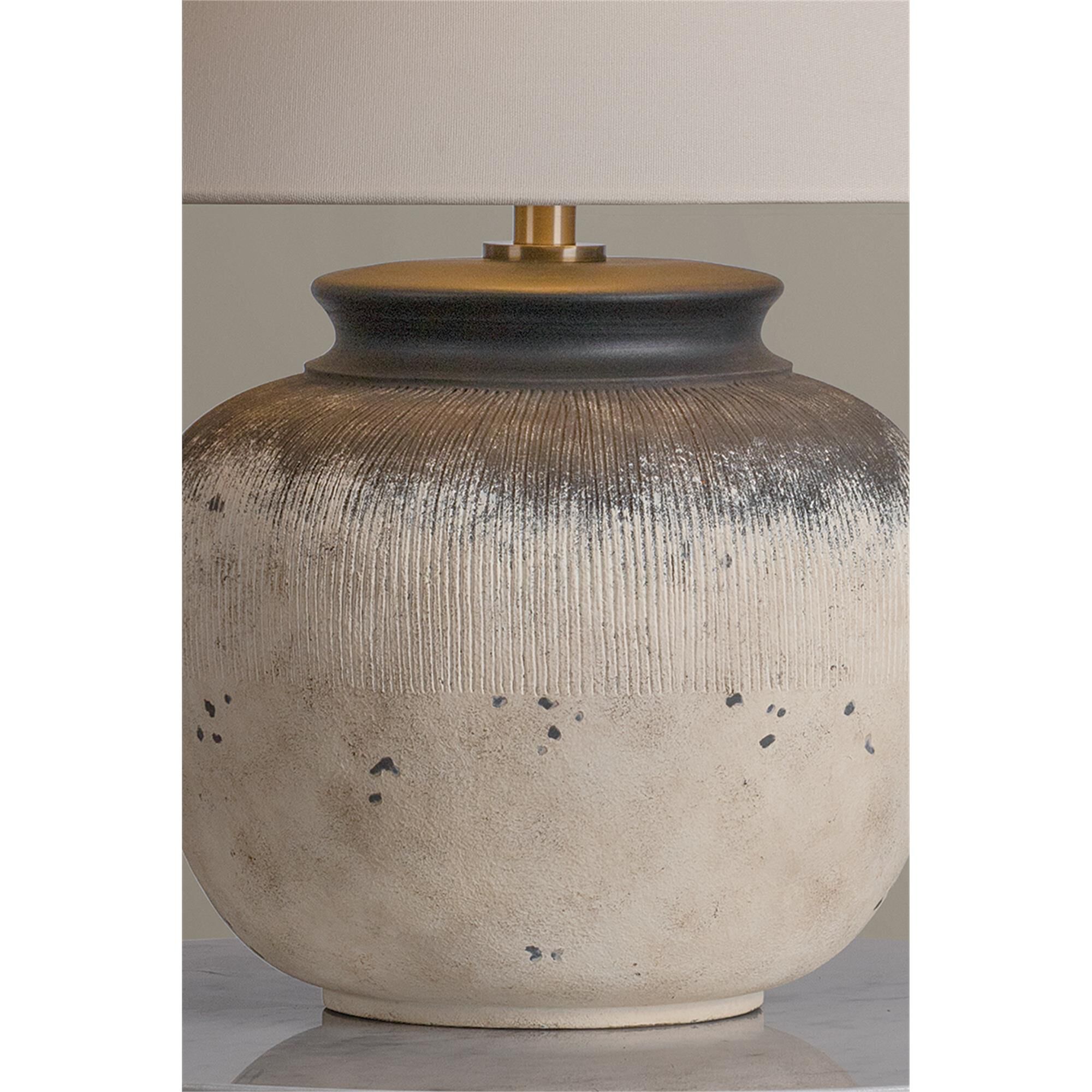 Shown in Patina Brass and Ceramic Flamed White finish and Off White Linen shade