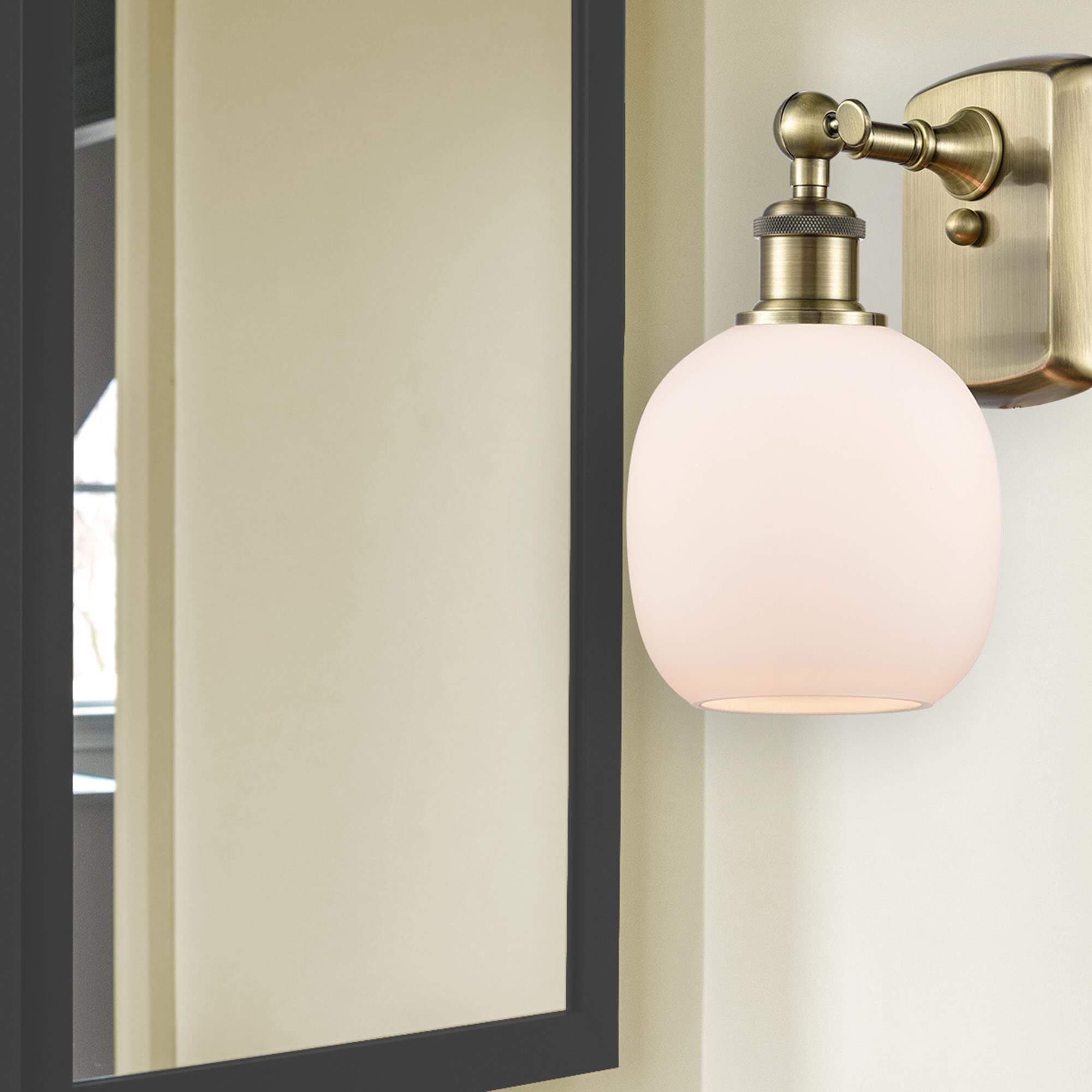 Shown in Antique Brass finish and Matte White Belfast glass and None shade