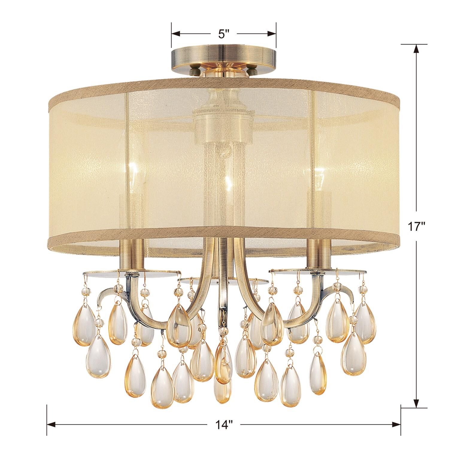 Shown in Antique Brass finish and Etruscan Teardrop Almond crystal and Silk glass and Translucent Gold shade