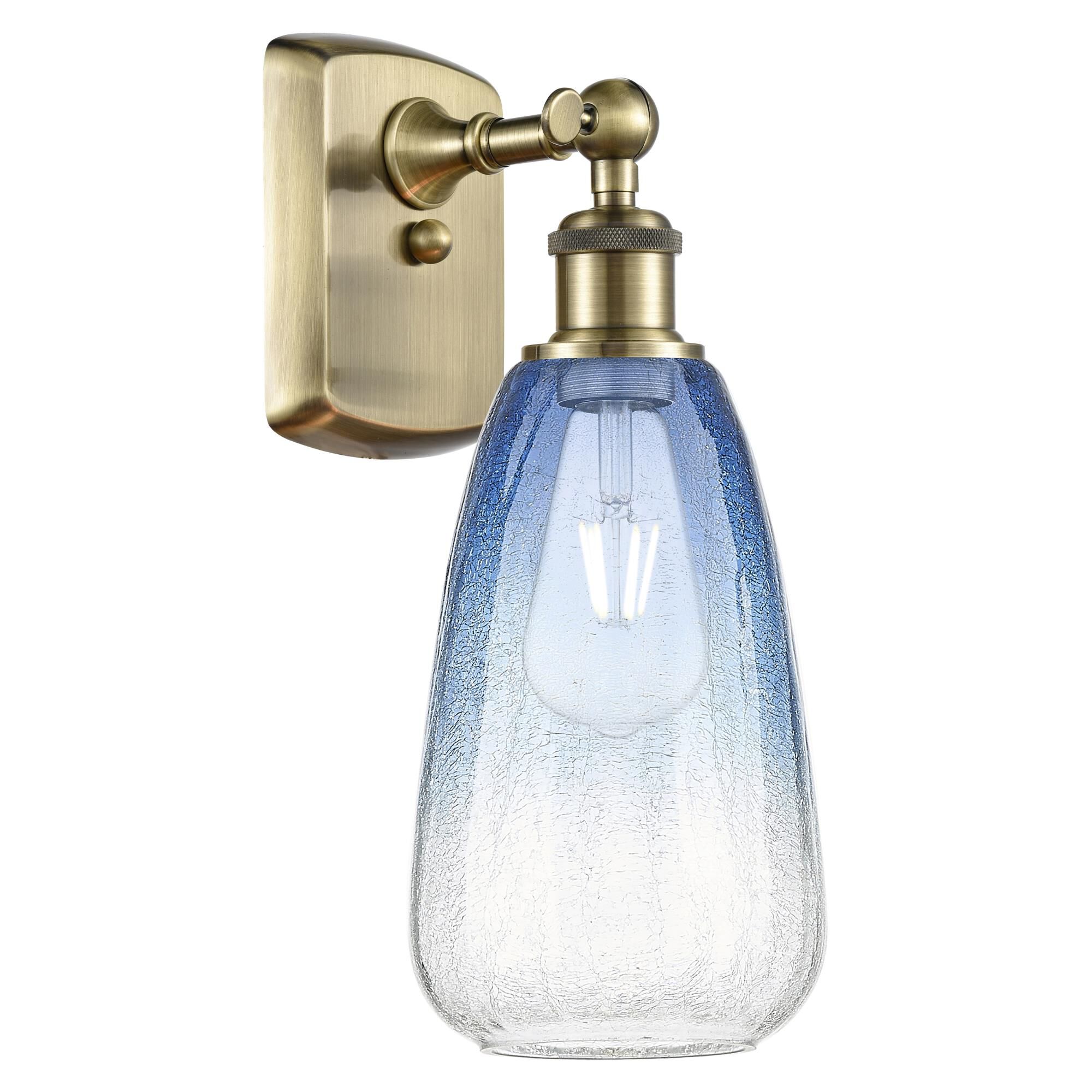 Shown in Antique Brass finish and Sapphire Blue glass