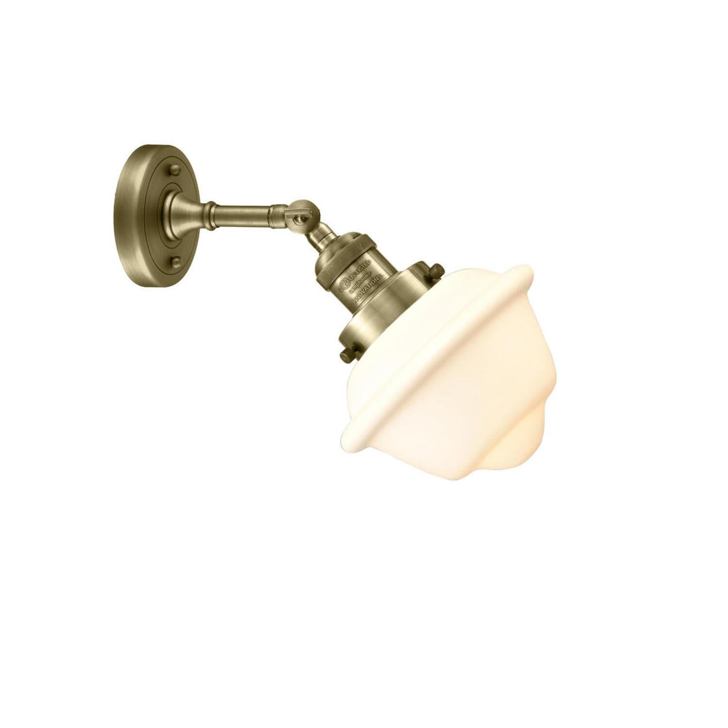 Shown in Antique Brass finish and Matte White glass