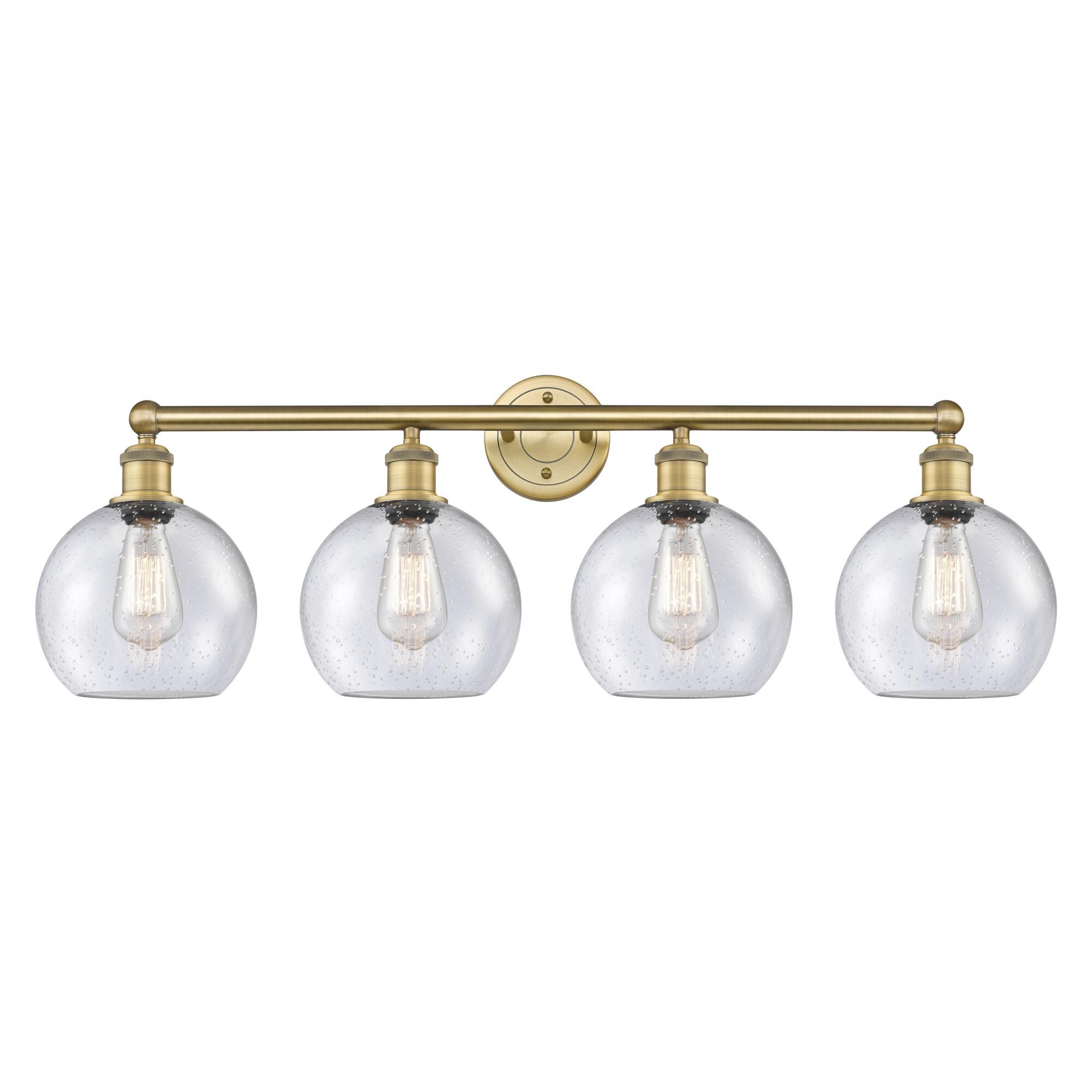 Shown in Brushed Brass finish and Seedy glass