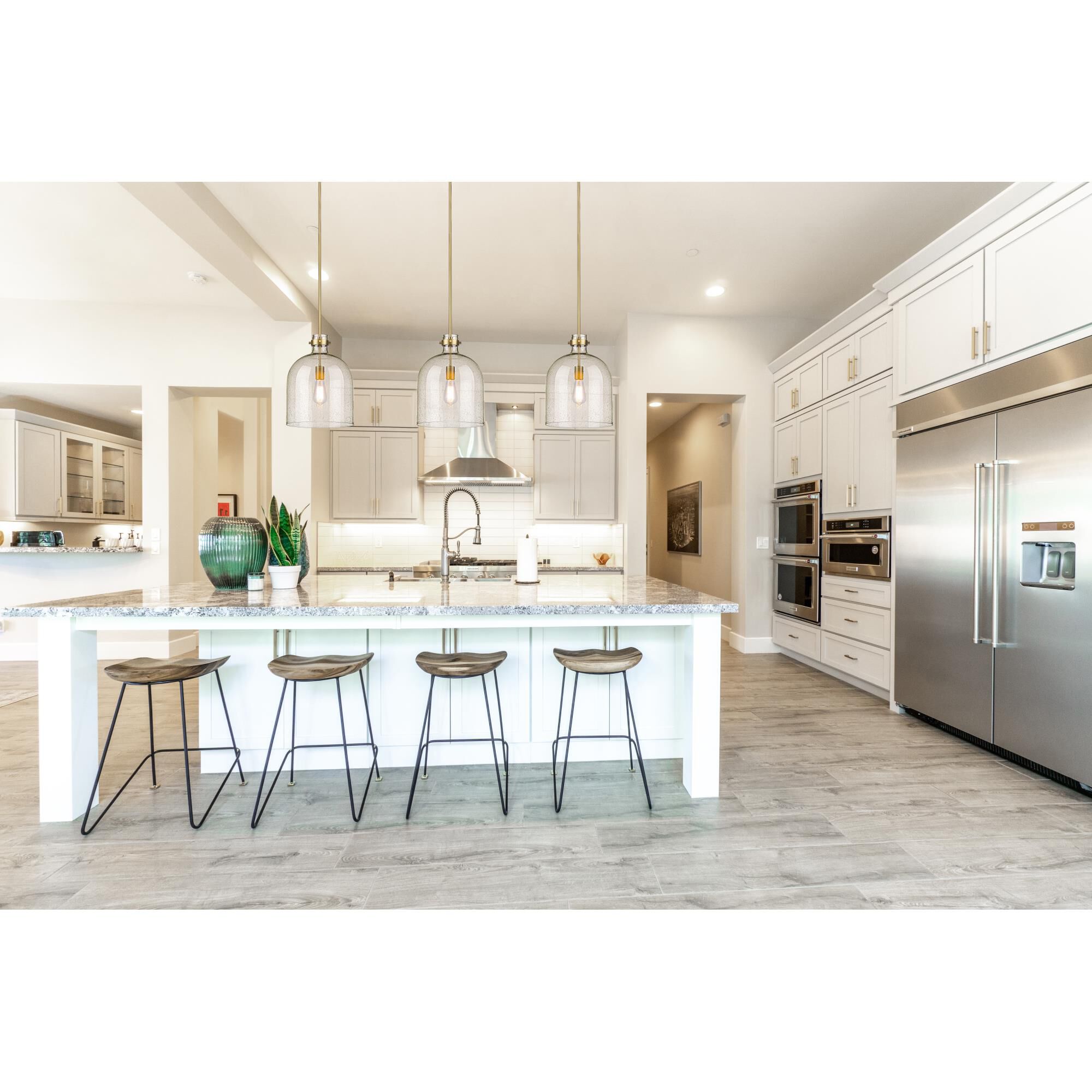 Shown in Rubbed Brass finish and Clear Seedy glass and No Shade shade